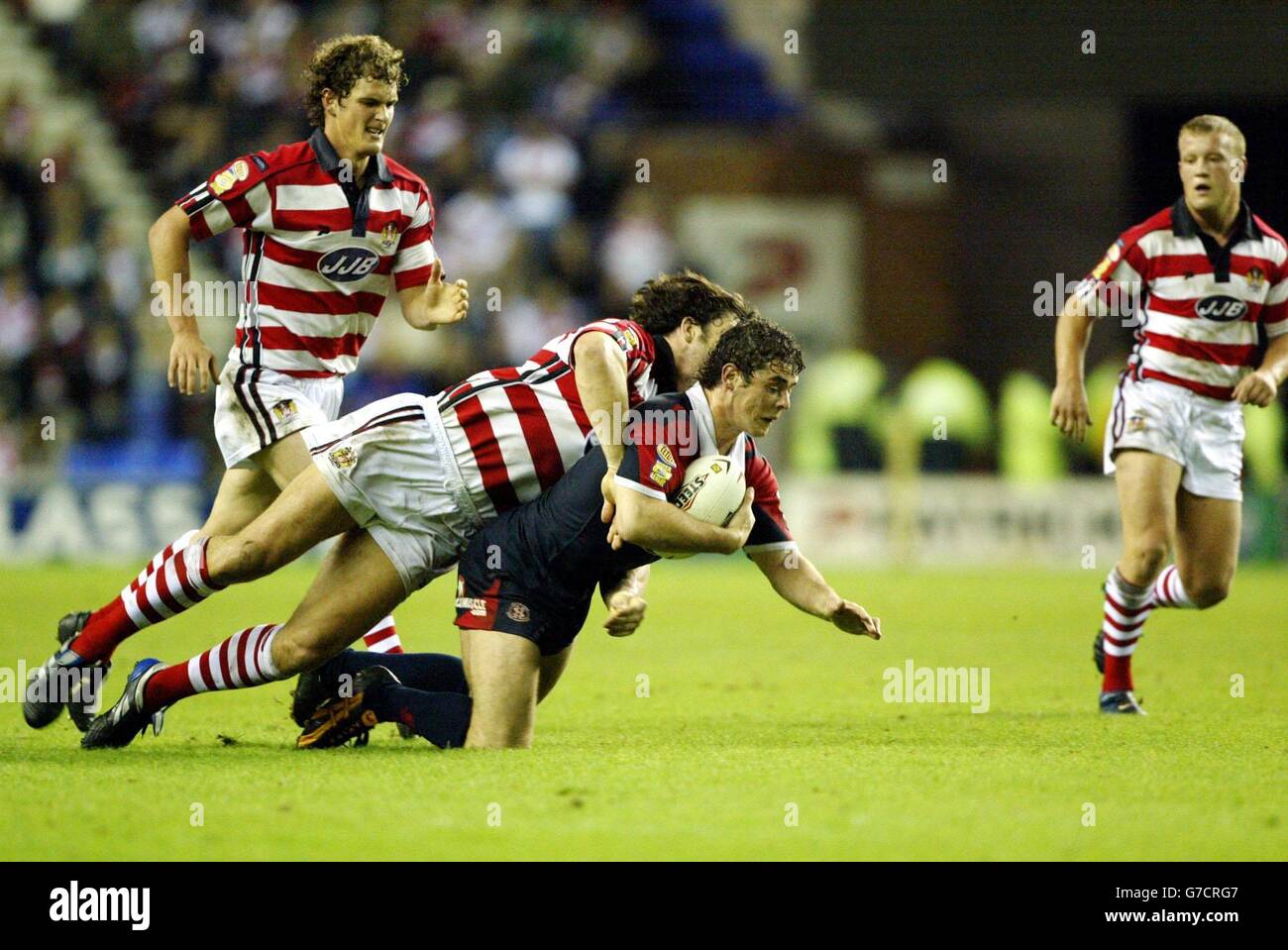 Wigan's Andy Farrell brings down St Helens' Lee Gilmour during the Tetley's Super League Elimination play-off at the JJB Stadium, Wigan. . Stock Photo