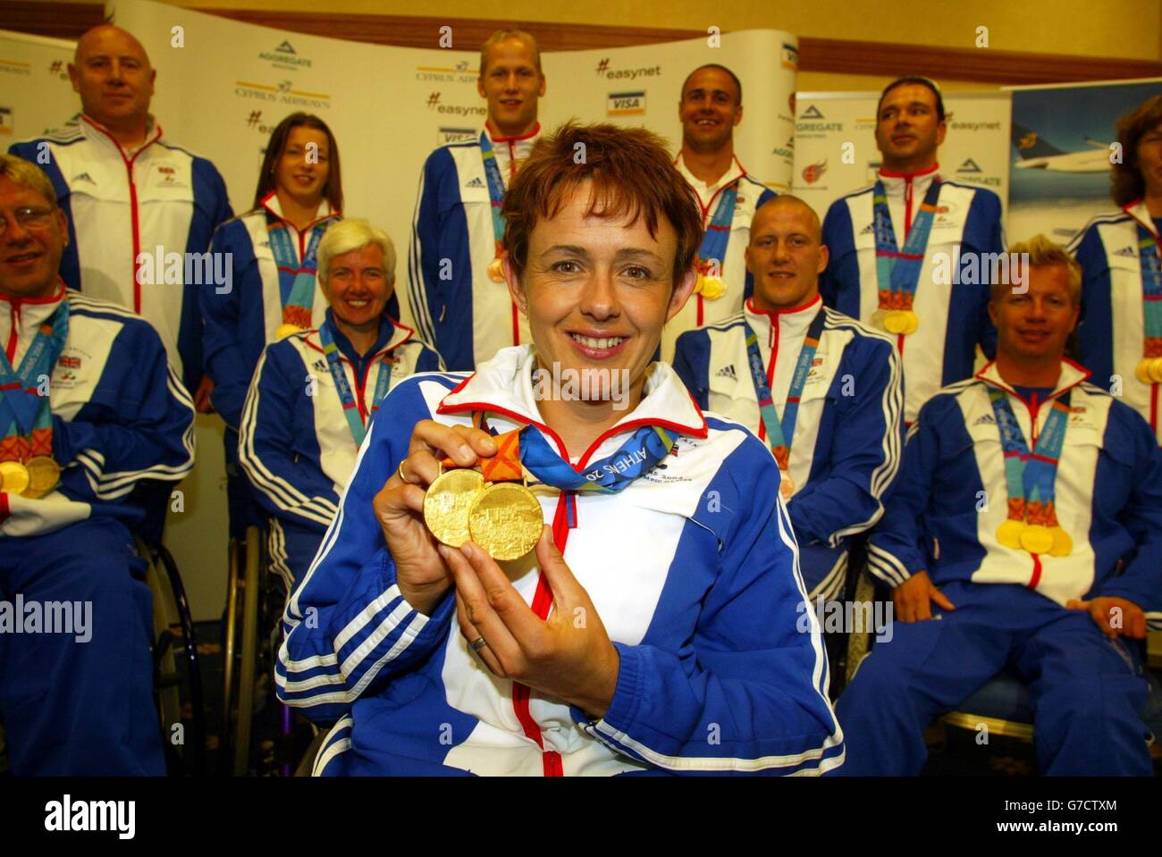 Wheelchair athlete Tanni Grey-Thompson, who led the way to become Britain's most successful ever Paralympian, winning her 11th gold medal, arrives back at Gatwick airport with the British Paralympic team. Stock Photo