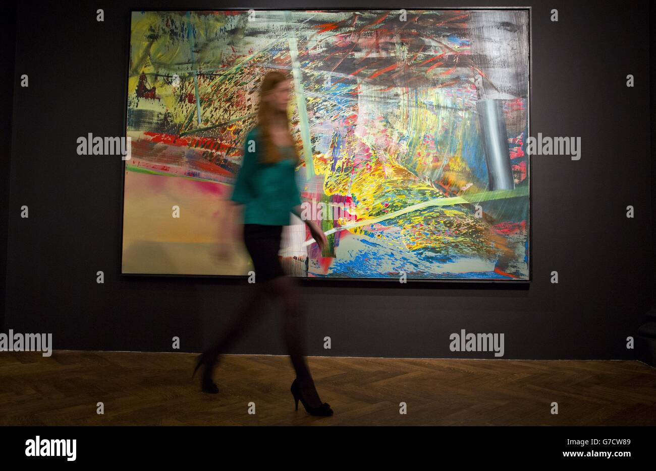 A gallery assistant passes by 'Netz', 1985 by Gerhard Richter and estimated at £7m - £10m which forms part of 44 major post-war artworks from the Essl collection due to go on sale at Christie's Mayfair in London on October 13. Stock Photo