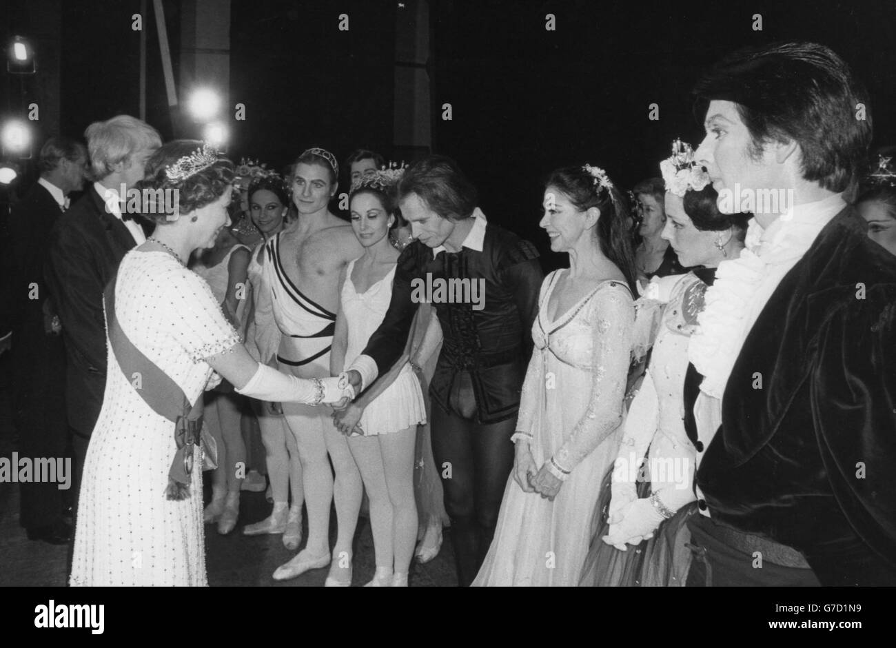 The Queen meets Rudolf Nureyev and Dame Margot Fonteyn at the Royal Opera House in Covent Garden, where members of the Royal Family attended a Gala Silver Jubilee Performance of opera and ballet. Stock Photo