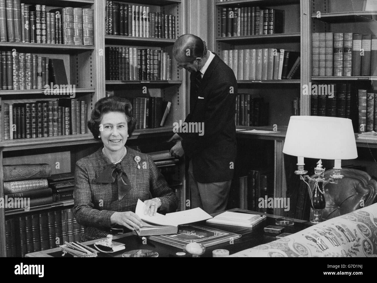 Queen Elizabeth II and the Duke of Edinburgh in the library at Balmoral during their traditional summer break. Stock Photo