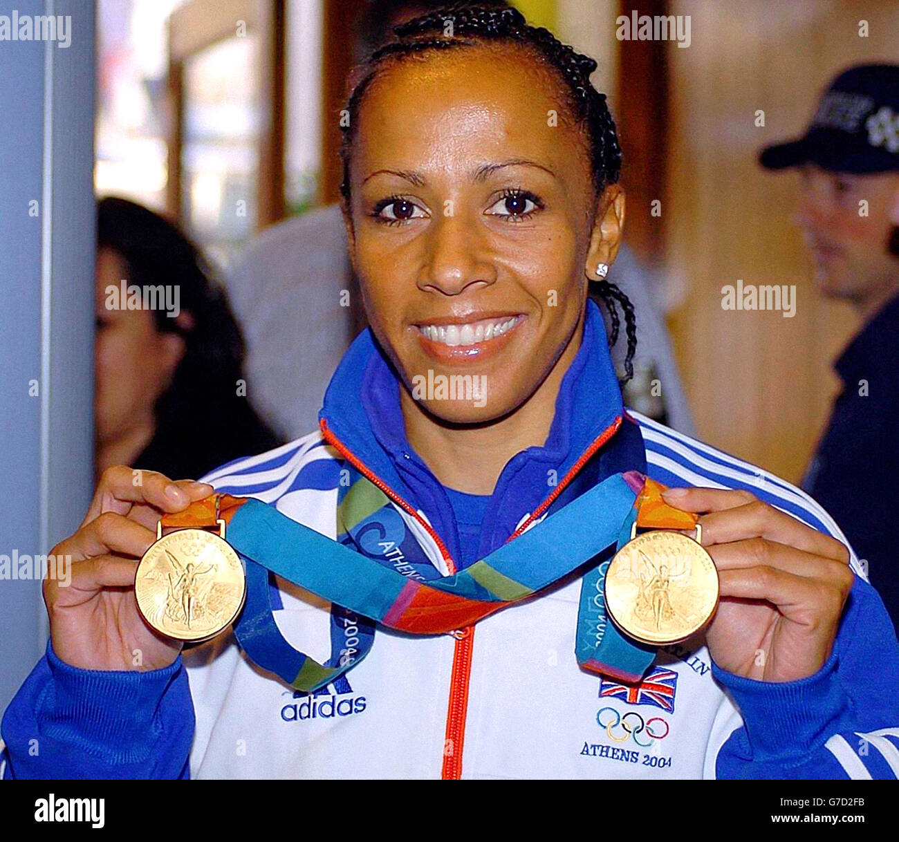 Kelly Holmes arrives for the Parade of the Heroes with her two gold medals, won in the women's 800metres and 1500metres athletics events, in Piccadilly, central London at the start of the victory parade to salute Britain's Olympic heroes. The summer Olympics was Britain's best team performance since 1924. The parade will also champion London's hopes of hosting the 2012 Games. *06/12/04: Double Olympic gold medallist, Kelly Holmes is due to officially launch her new book. In My Olympic Ten Days, Holmes recounts her thoughts, hopes and fears as she progresses through the Athens games to achieve Stock Photo