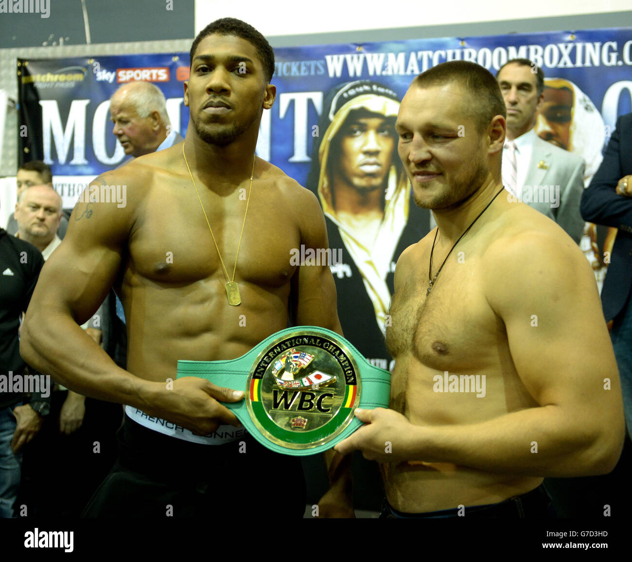 Great Britain's Anthony Joshua (left) with Russia's Denis Bakhtov (right) during the weigh in at Reebok Sports Club, London. Stock Photo