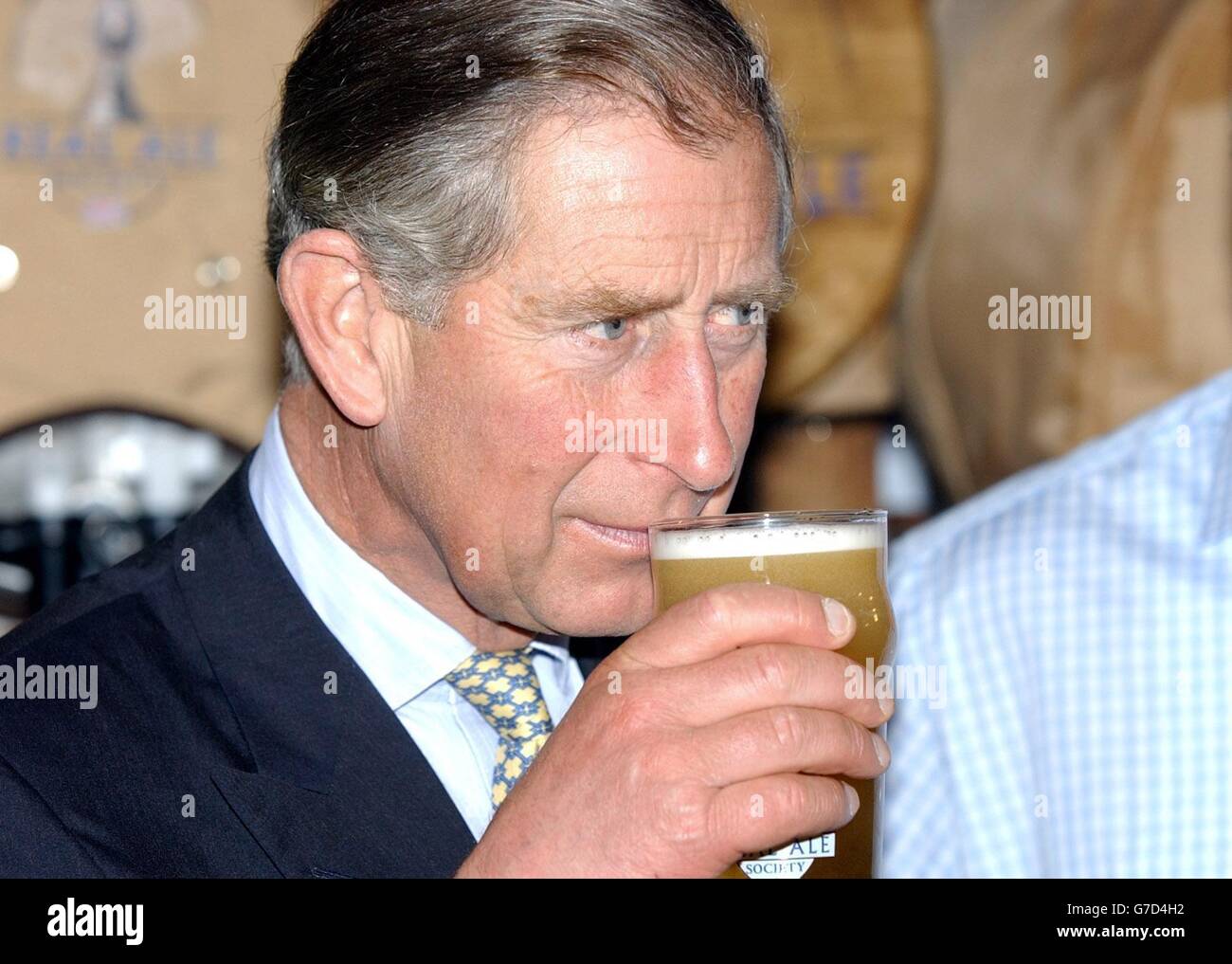 The Prince of Wales, prepares to taste a pint of Summer Lightning real ale from England's Hop Back brewery at the Lingotto complex in Turin, Italy, during a visit to the 'Salone Del Gusto' food festival. Stock Photo