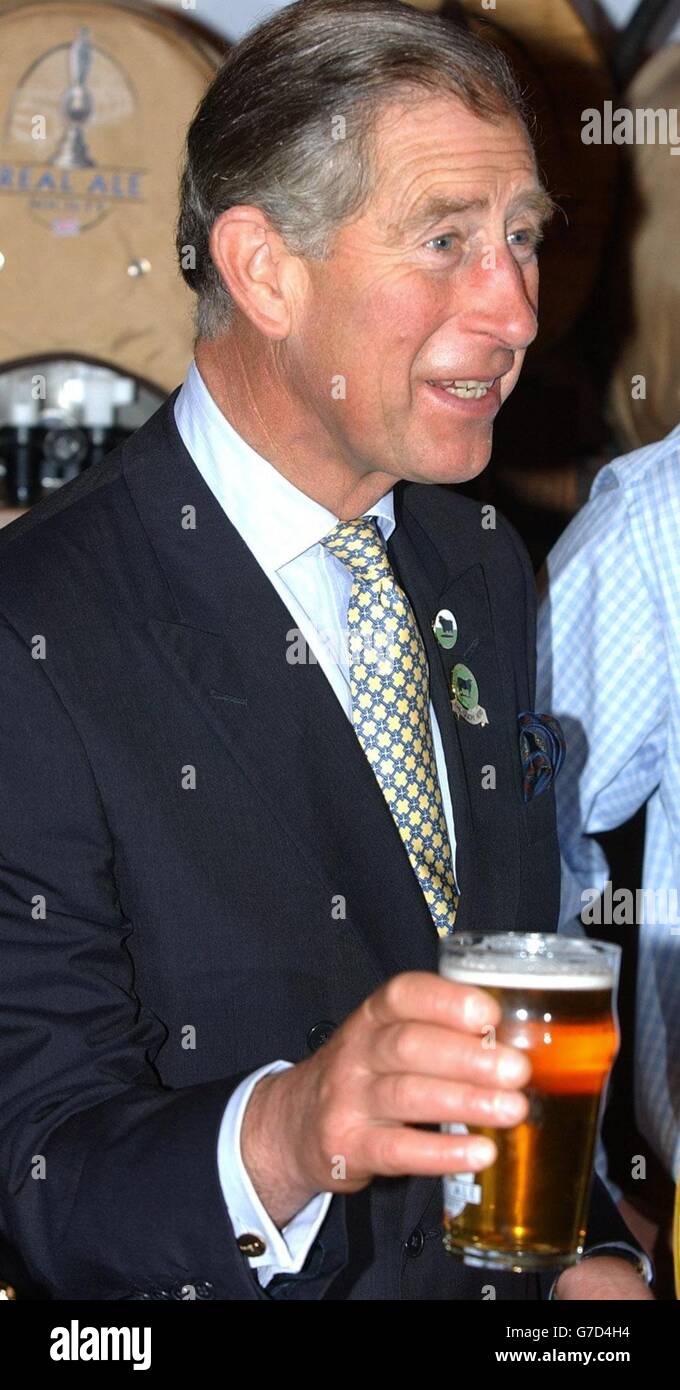 The Prince of Wales, holds a pint of Summer Lightning real ale from England's Hop Back brewery at the Lingotto complex in Turin, Italy, during a visit to the 'Salone Del Gusto' food festival. Stock Photo