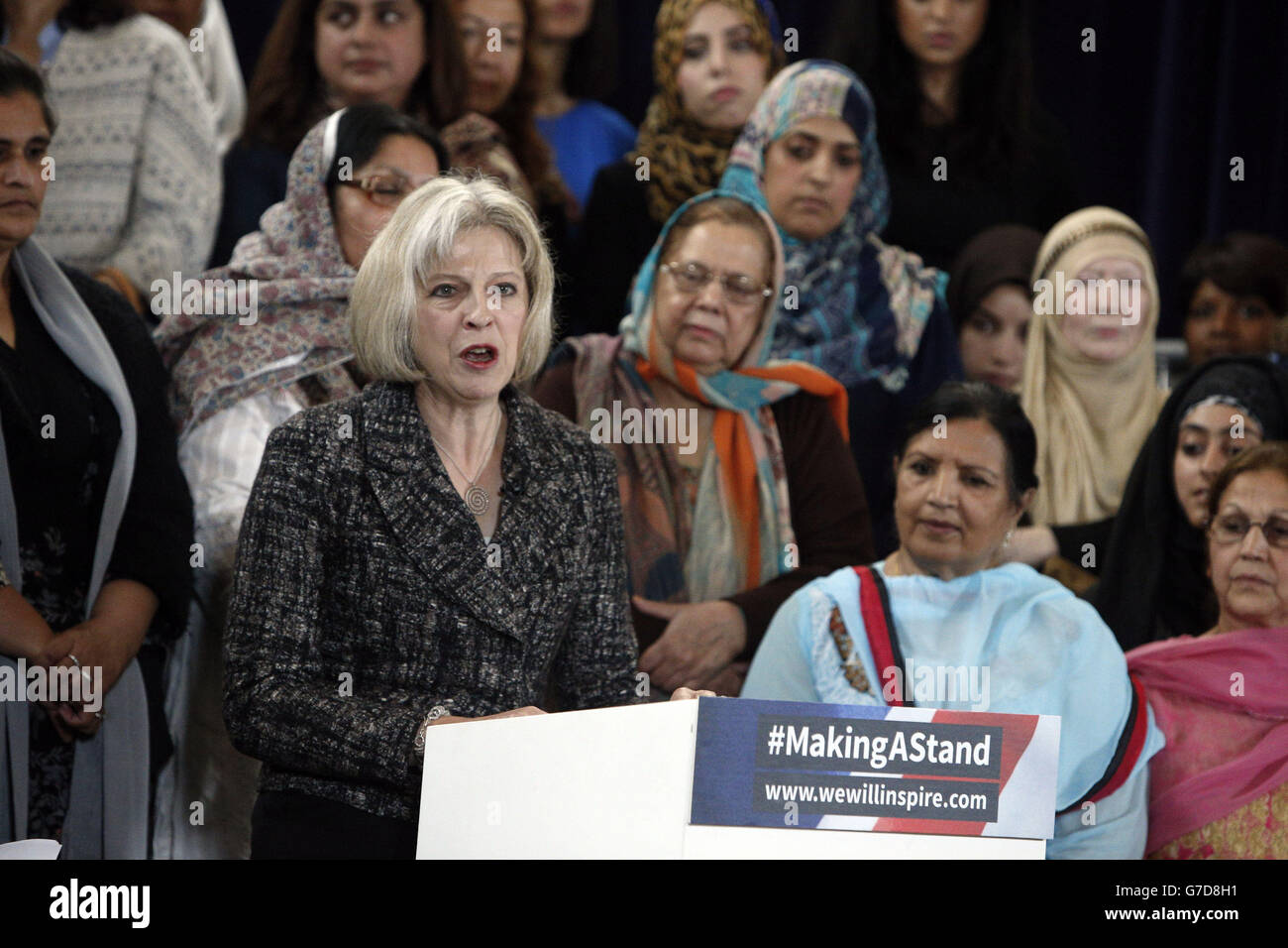 Home Secretary Theresa May speaks at the Making A Stand launch event in central London, the event which was organised by Inspire features Muslim women from across the UK who are making a united stand rejecting the barbarism of the Islamic State. Stock Photo
