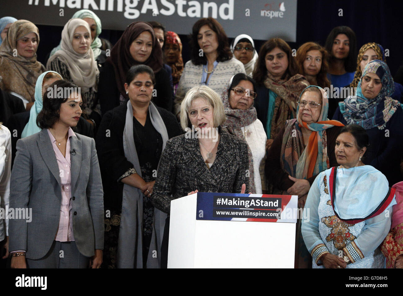 Home Secretary Theresa May speaks at the Making A Stand launch event in central London, the event which was organised by Inspire features Muslim women from across the UK who are making a united stand rejecting the barbarism of the Islamic State. Stock Photo