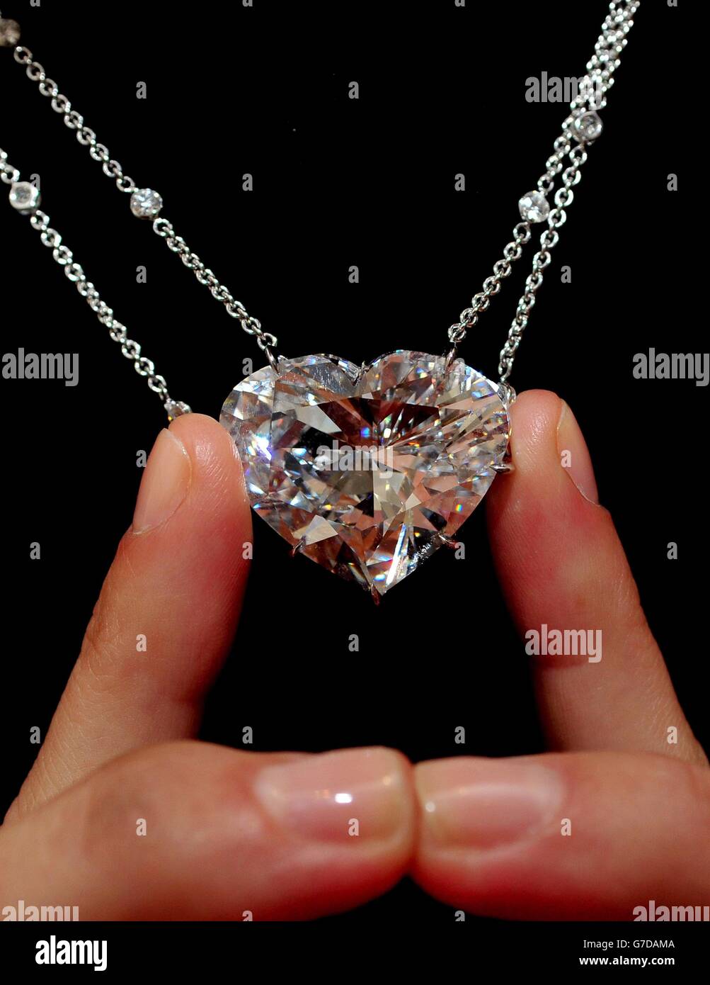 A Sotheby's assistant shows a 50.05 Carat heart-shaped D-colour internally flawless diamond pendant which will form part of their Hong Kong Magnificent Jewels and Jadite Autumn sale on October 7th in Hong Kong with an estimate of between HK$ 60 -70 million or US$7.7 - 9 million. Stock Photo