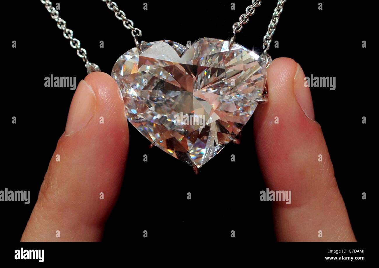 A Sotheby's assistant shows a 50.05 Carat heart-shaped D-colour internally flawless diamond pendant which will form part of their Hong Kong Magnificent Jewels and Jadite Autumn sale on October 7th in Hong Kong with an estimate of between HK$ 60 -70 million or US$7.7 - 9 million. Stock Photo