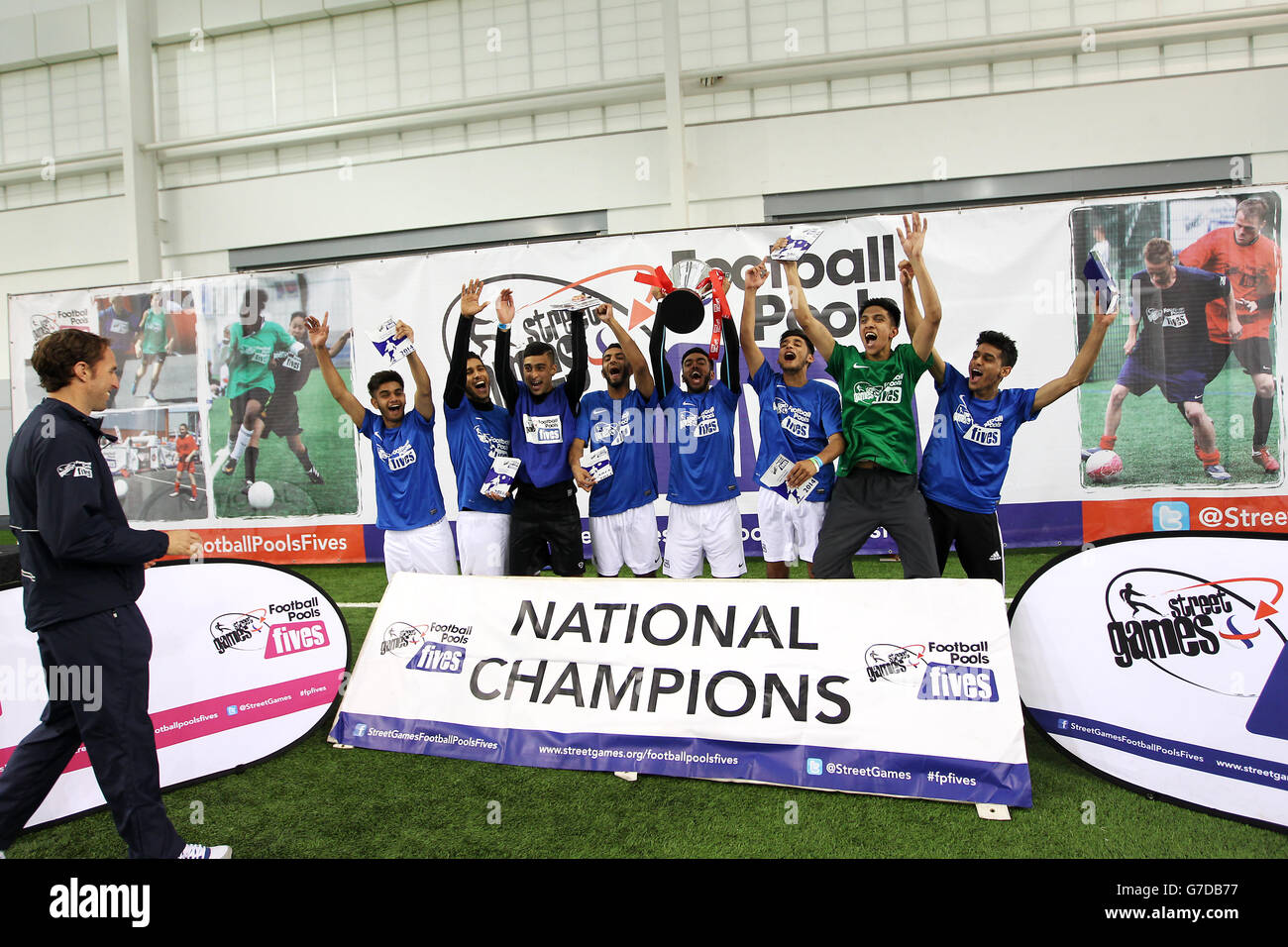 Gareth Southgate presents the winning team with their trophy at the StreetGames Football Pools Fives event at St George's Park, Burton Stock Photo