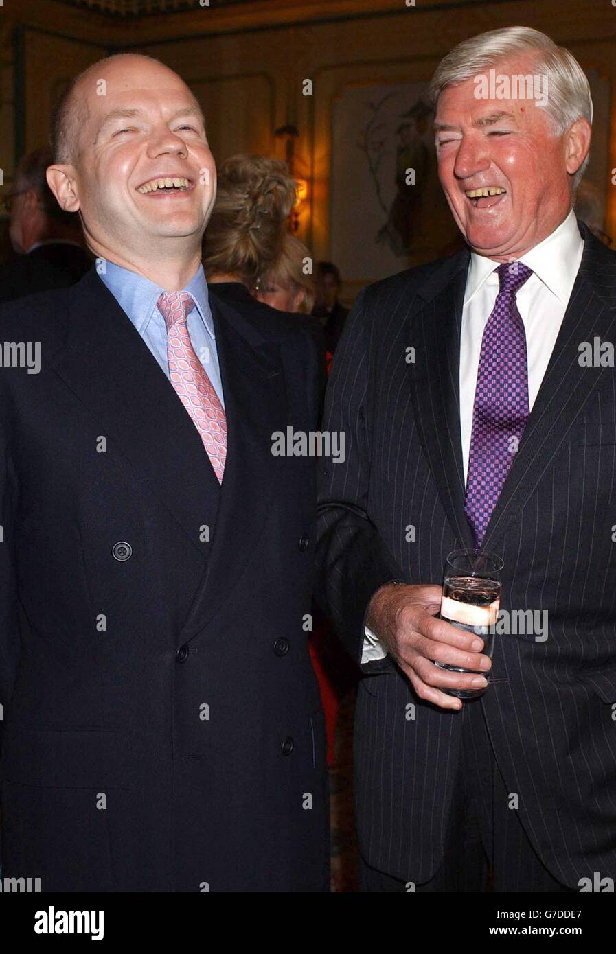 William Hague MP (left) and Cecil Parkinson share a joke during the Foyles Literay Luncheon at the Dorchester Hotel in Park Lane, central London. Stock Photo