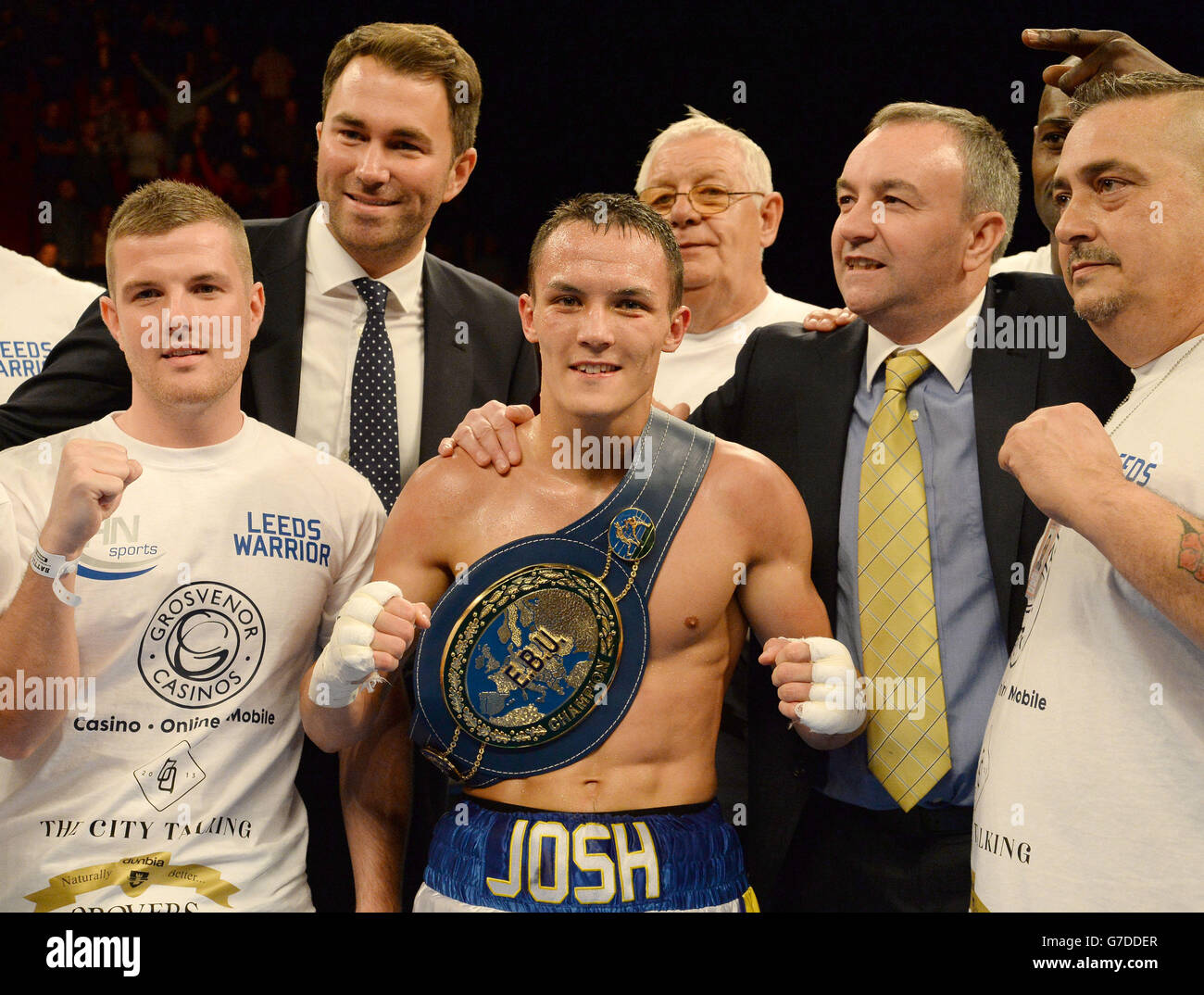 Josh Warrington (centre) celebrates after beating Davide Dieli in the European Featherweight title contest at the First Direct Arena, Leeds. Stock Photo