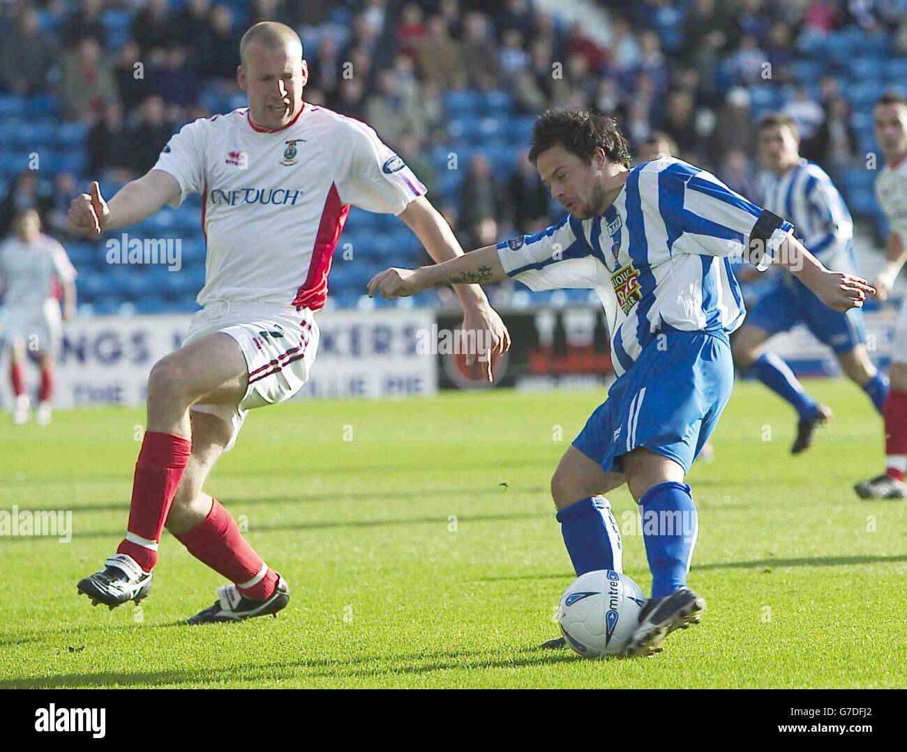 Kilmarnock's Stephen Murray opens the scoring past Inverness CT's Ross Tokley, during the Bank of Scotland Premier League match at the Rugby Ground, Kilmarnock, Saturday October 23, 2004. . Stock Photo