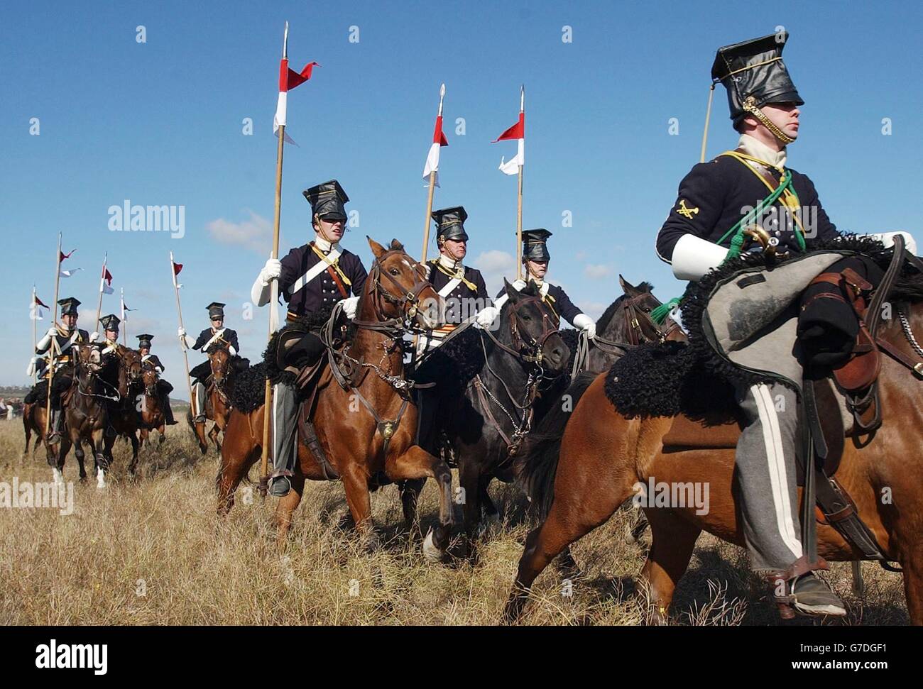 A re-enactment of the 17th Lancers 'Charge of The Light Brigade' through The Valley of Death wearing Drill Order of Brigade in The Crimea, Ukraine. The 150th Anniversary of the famous battle is tomorrow. Stock Photo