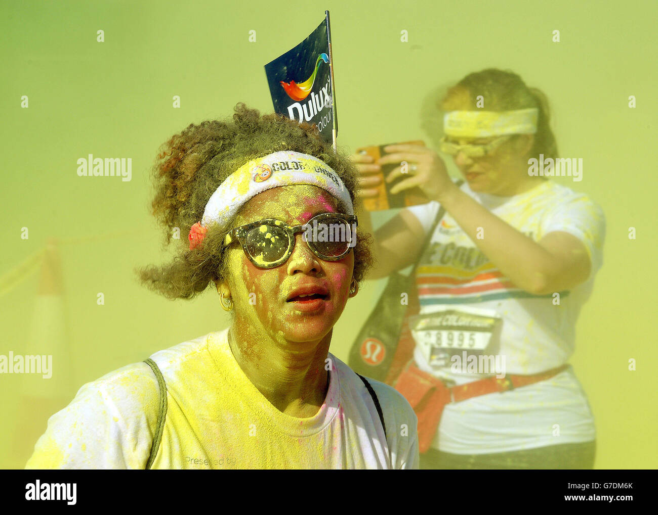 Competitors part in dulux color run hires stock photography and images