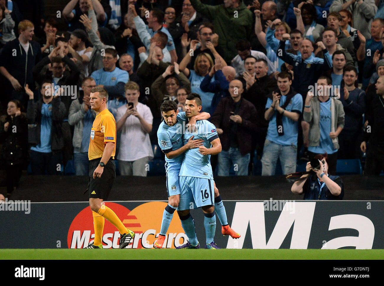 Manchester City's Sergio Aguero celebrates scoring the opening goal of the game during the UEFA Champions League match at the Etihad Stadium, Manchester. PRESS ASSOCIATION Photo. Picture date: Tuesday September 30, 2014, See PA story SOCCER Man City. Photo credit should read: Martin Rickett/PA Wire. Stock Photo