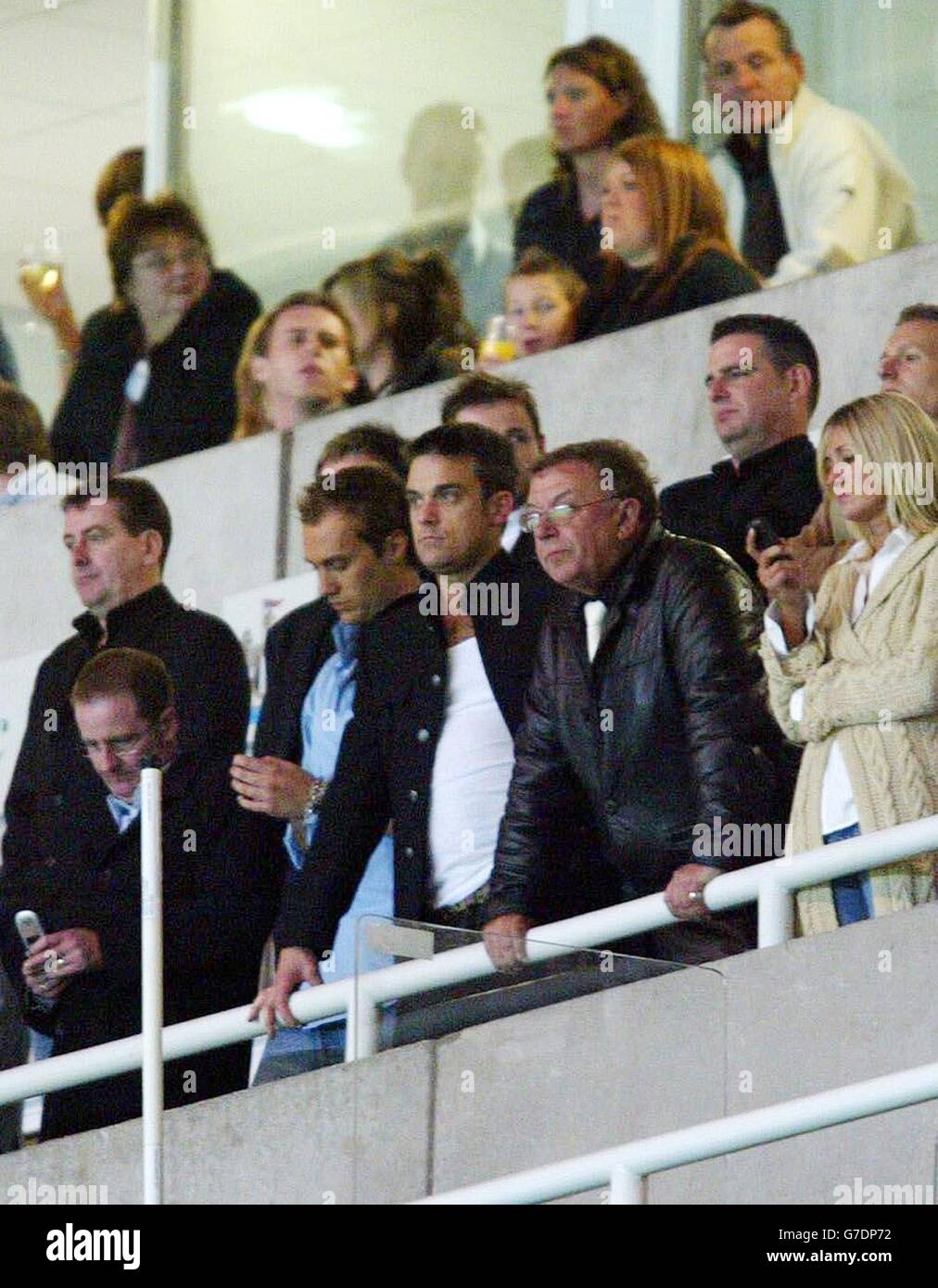 Robbie Williams (centre) watching Sky One's 'The Match' live final being played at St James Park, Newcastle upon Tyne. Stock Photo