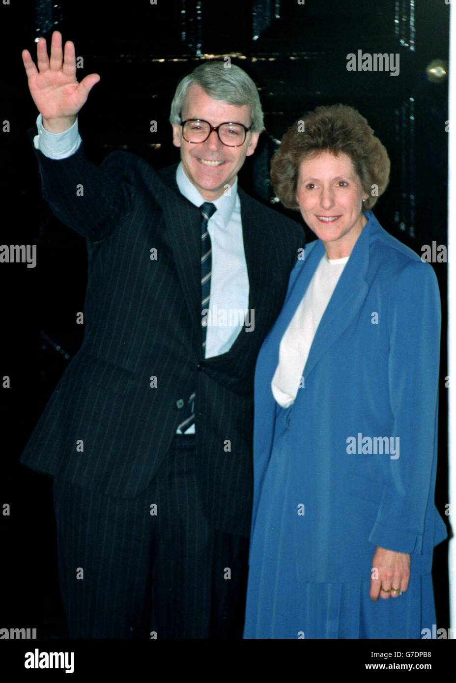 Prime Minister-to-be John Major, outside 11 Downing Street with his wife Norma, celebrates after the leadership ballot result. Stock Photo