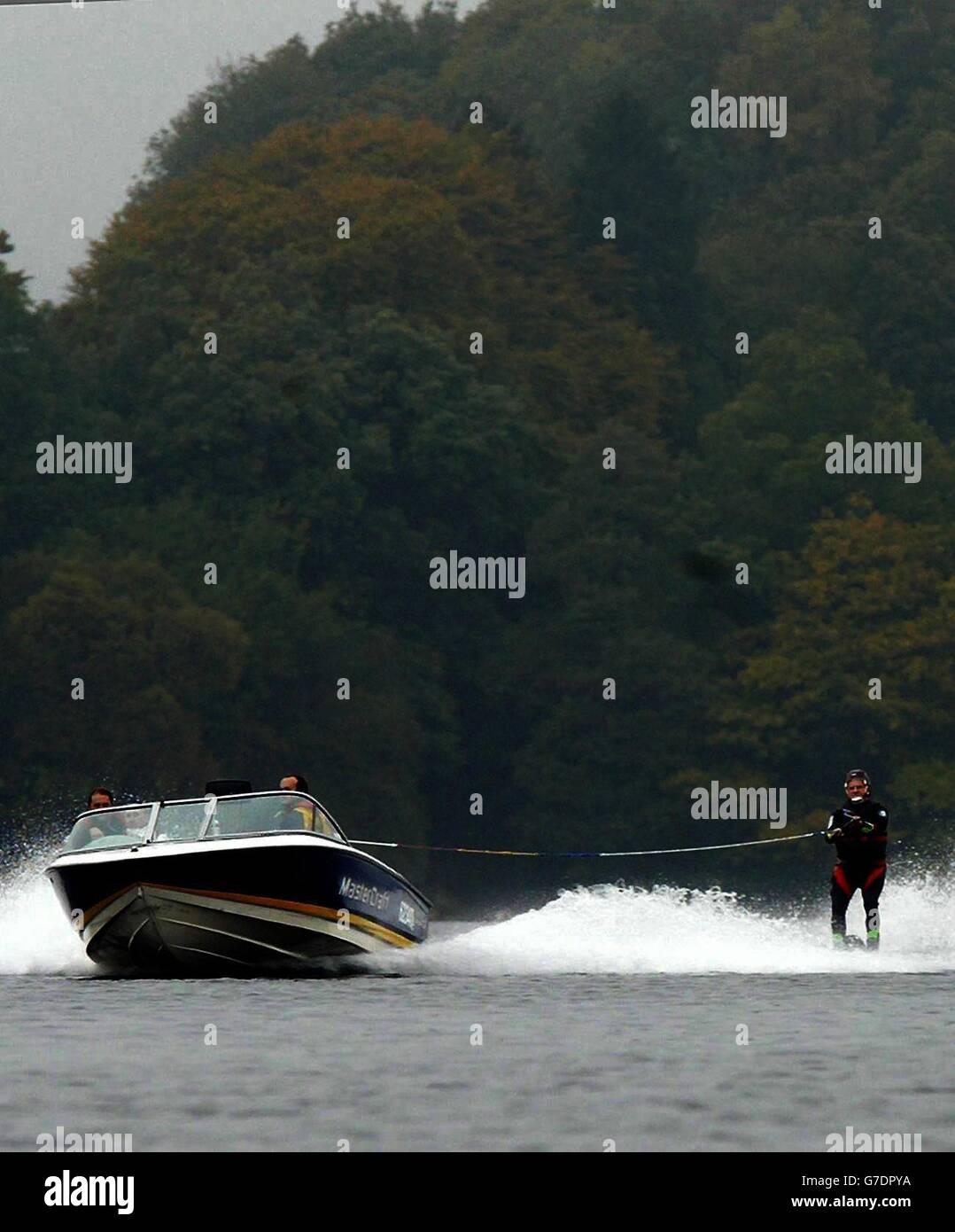 Blind water skier Gerald Price, 71, is pulled through the water by blind speed boat driver Mark Threadgold as Gerald breaks the Blind water ski speed record on Lake Windermere, Cumbria during the annual Windermere Records Week. Stock Photo