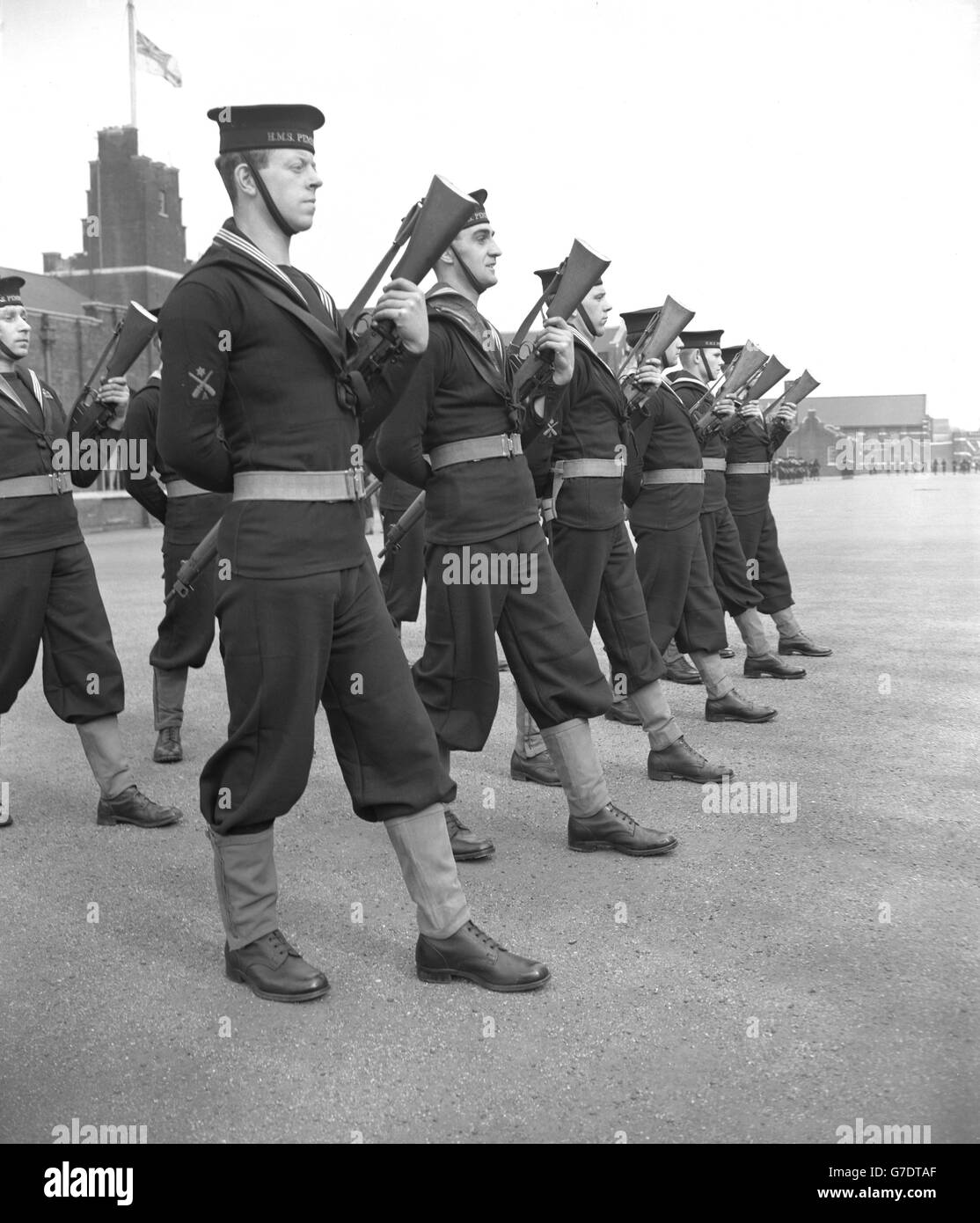 Naval ratings slow-marching with reversed arms at the Royal Naval Barracks, Chatham. They are rehearsing their key role in Sunday's solemn procession in London when the body of Queen Mary is taken from the Queen's Chapel of St James's Palace, beside Marlborough House, to Westminster Hall for the lying-in-state. Stock Photo