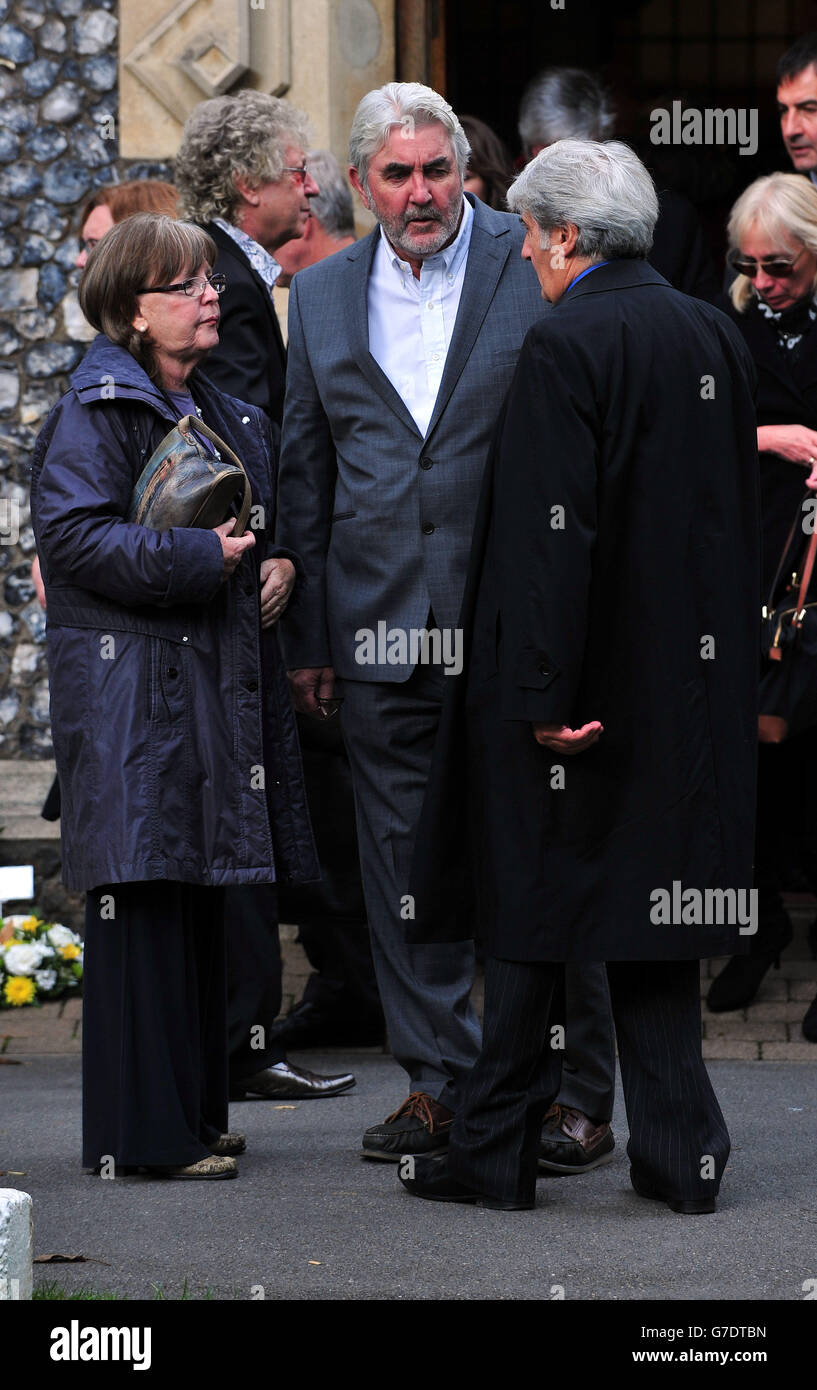 (left to right) Pauline Collins, John Alderton and Tom Conti hug each other as they leave following the funeral of Lynsey de Paul in the South Chapel at Hendon Cemetery, north London. Stock Photo