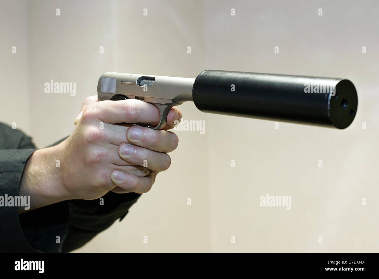 A Browning pistol which has had an Ingrams Mac 10 silencer fitted to it, recovered during a police anti drug and fire arm operation 'Vezere' in Lewisham Way, Lewisham. Stock Photo