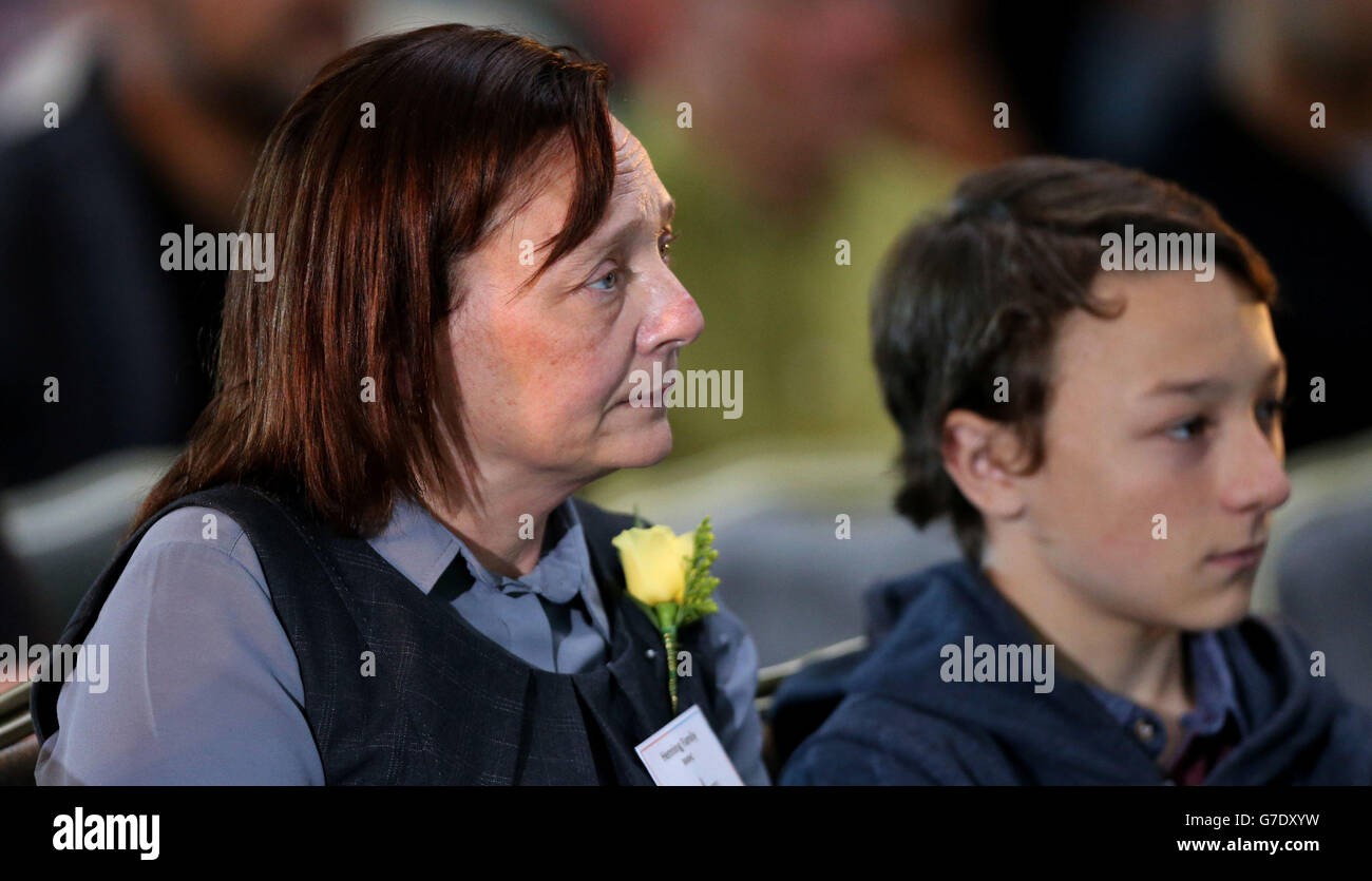 Barbara Henning, wife of Alan Henning with their son Adam, sits in the