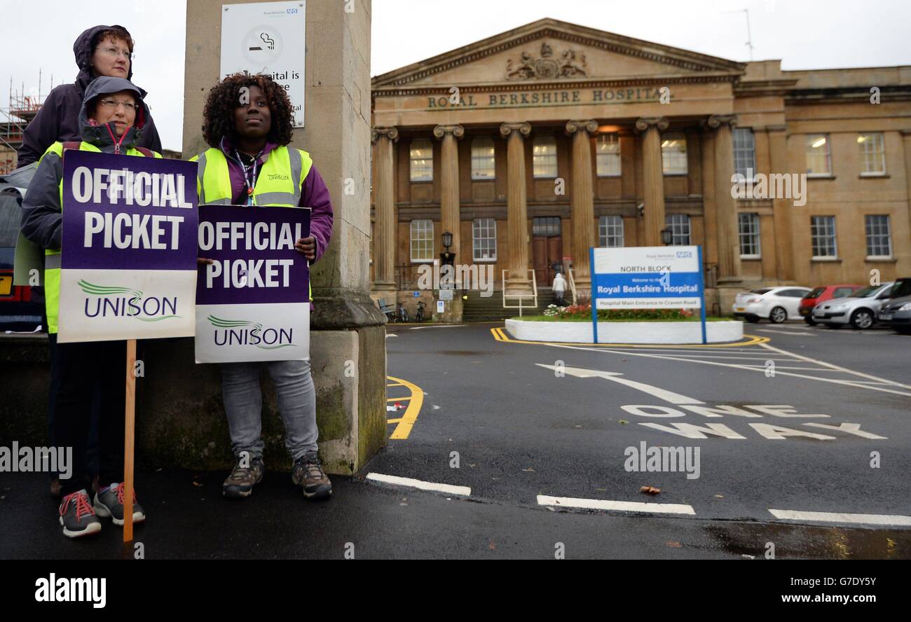 NHS workers protest outside the Royal Berkshire Hospital in Reading as hundreds of thousands of health workers have walked out on strike, many for the first time in their lives, in protest at the Government's decision not to give them a recommended 1% pay rise. Stock Photo