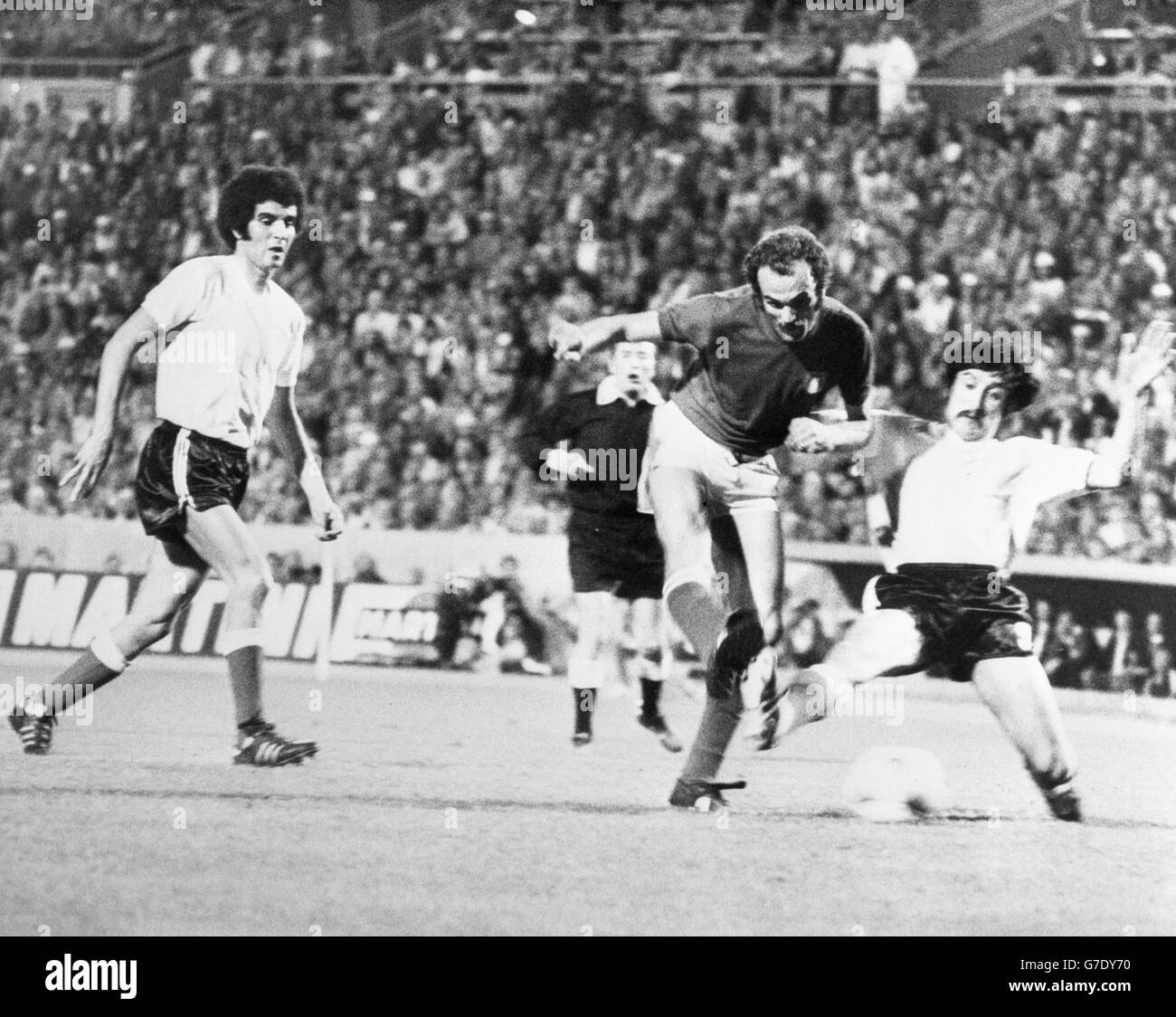 Italy's Sandro Mazzola squeezes past Argentina defenders Roberto Telch (left) and Ruben Oscar Glaria during a World Cup match at Stuttgart's Neckar Stadium. Stock Photo
