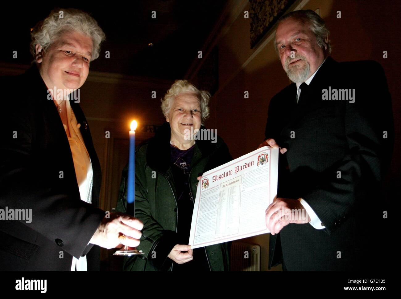 Rena Thomson (left) and Helen Cowan receive a pardon from Rob Gray at Gothenburg Public House Prestonpans near Edinburgh, as the town marked Halloween by officially pardoning 81 witches executed more than 400 years ago. Mrs Thomson had six ancestors killed. The pardons were granted under ancient feudal powers due to be abolished within weeks. Descendants and namesakes of those put to death in the town of Prestonpans, East Lothian, during Scotland's 16th and 17th century witch-hunts are expected to attend Sunday's ceremony. Stock Photo