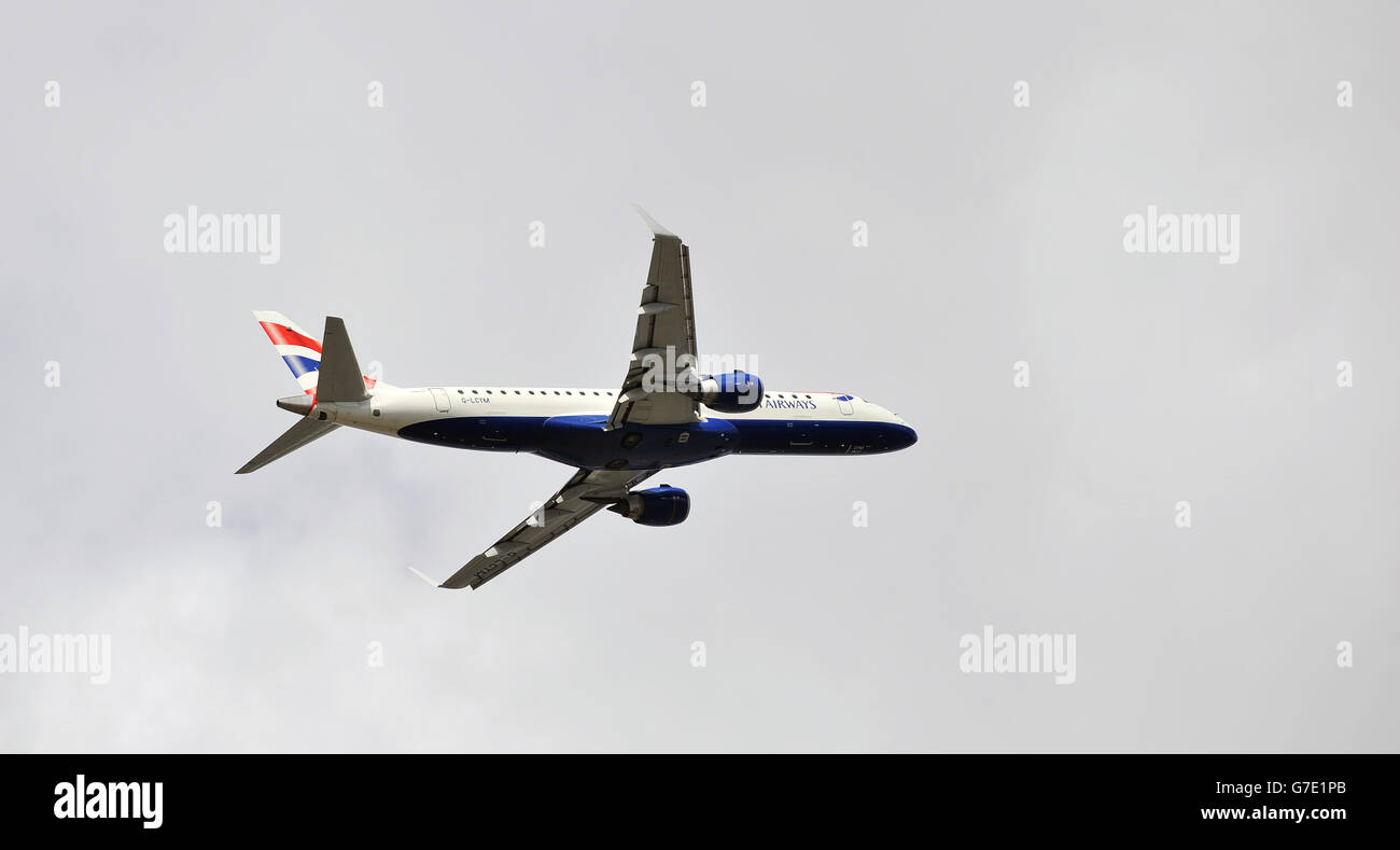 A British Airways (BA CityFlyer) Embraer EMB-190 jet , takes off from London City Airport in east London. Stock Photo