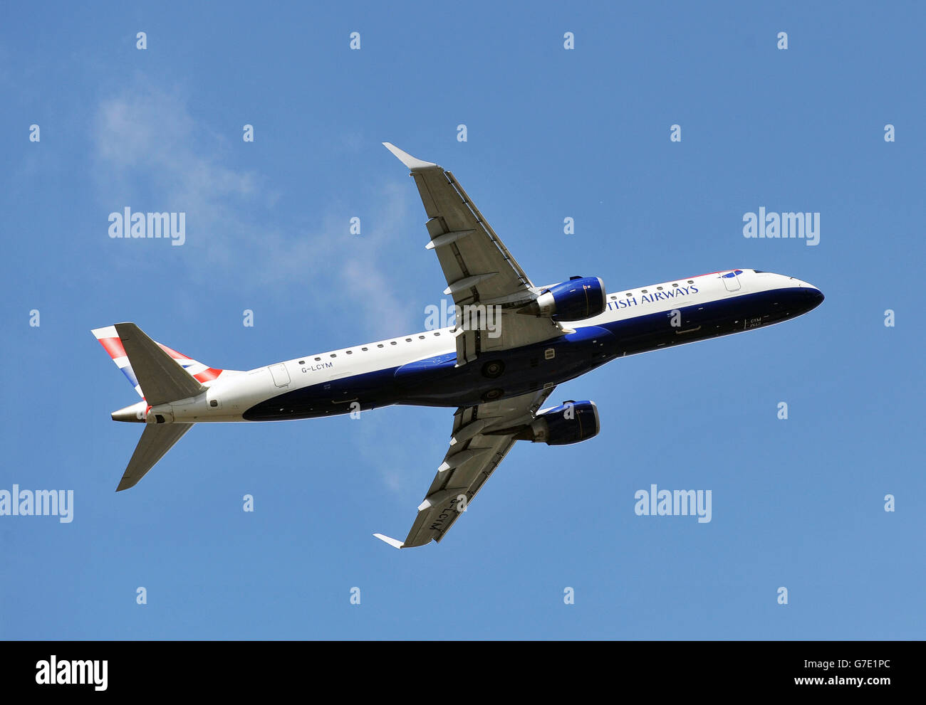 British Airways stock - London. A British Airways (BA CityFlyer) Embraer EMB-190 jet, takes off from London City Airport in east London. Stock Photo