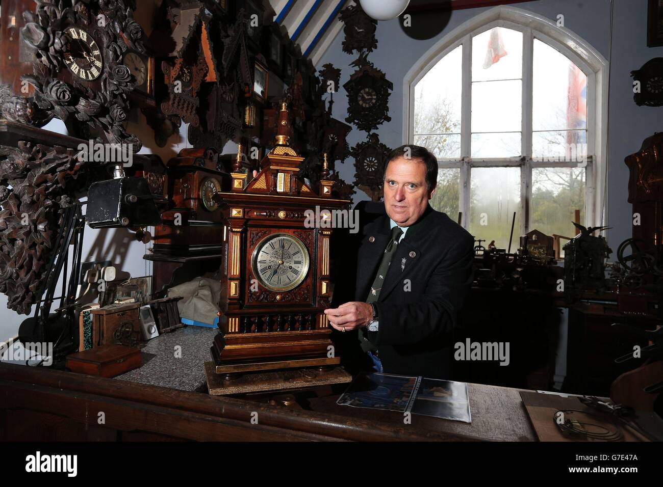 Horologist Roman Piekarski starts the time consuming task of adjusting