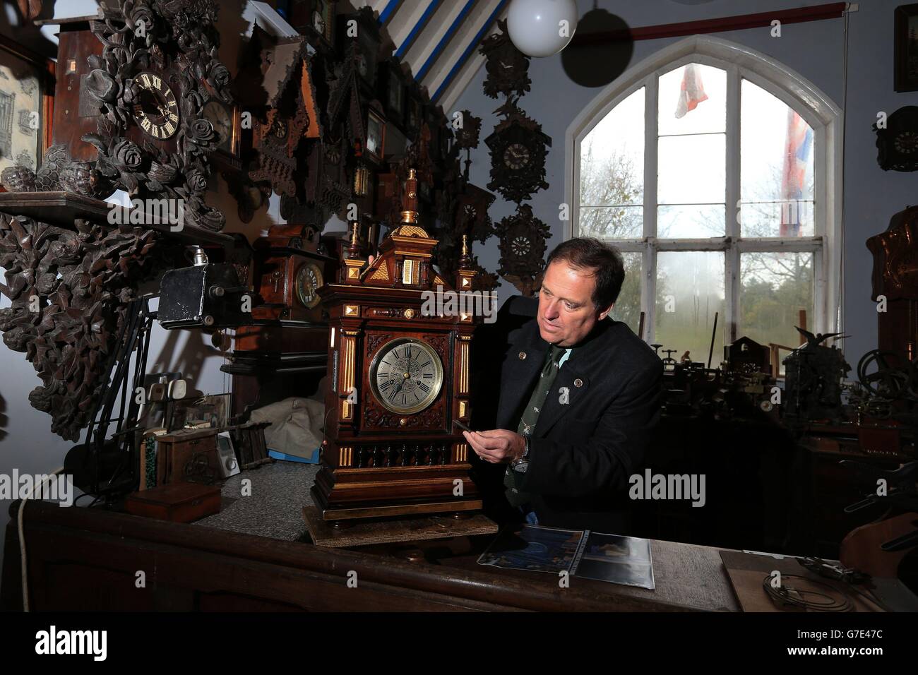 Horologist Roman Piekarski starts the time consuming task of adjusting