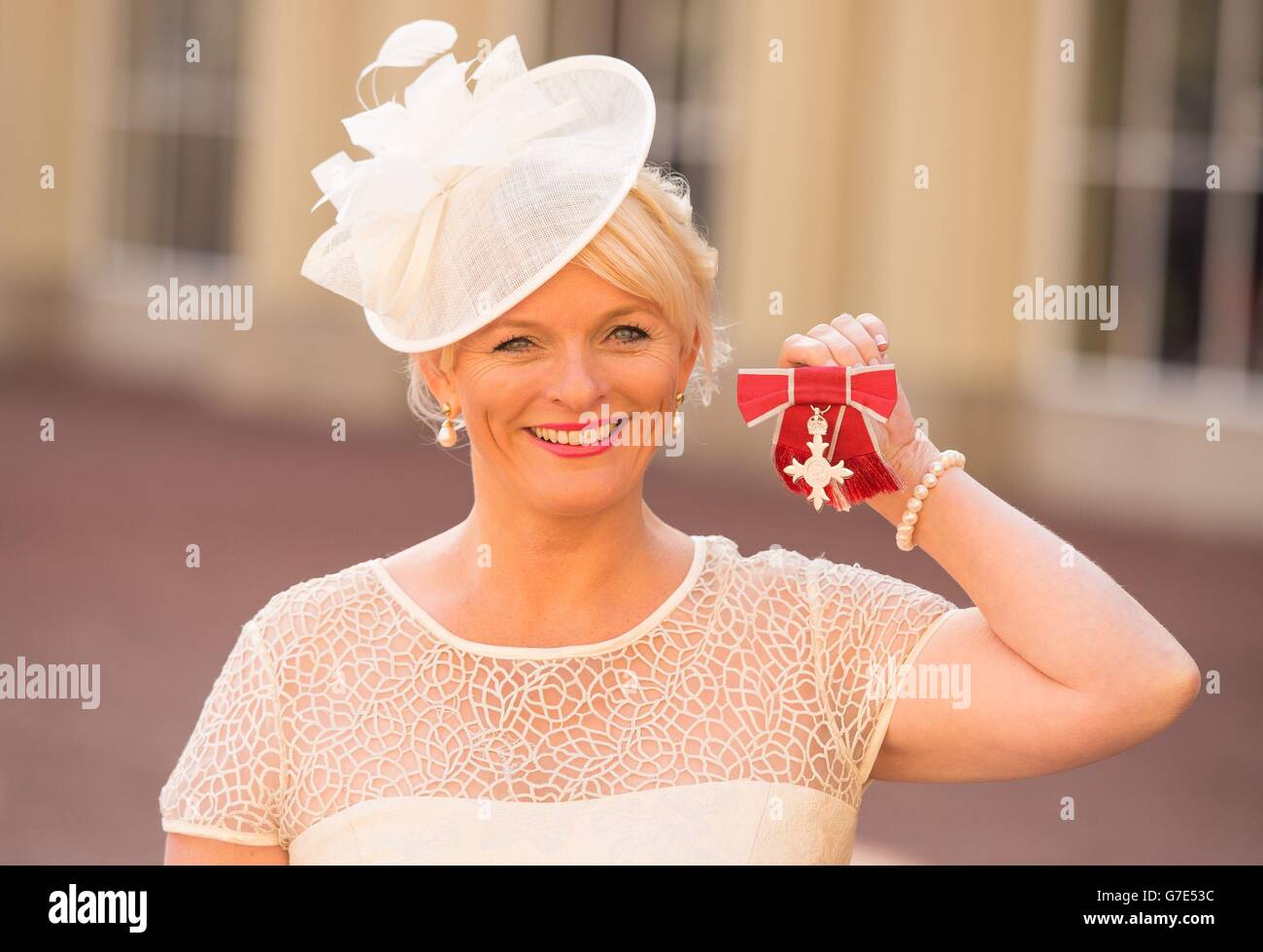 Everton FC Deputy Chief Executive Denise Barrett-Baxendale with her MBE medal, awarded during an investiture ceremony at Buckingham Palace, in central London. Stock Photo