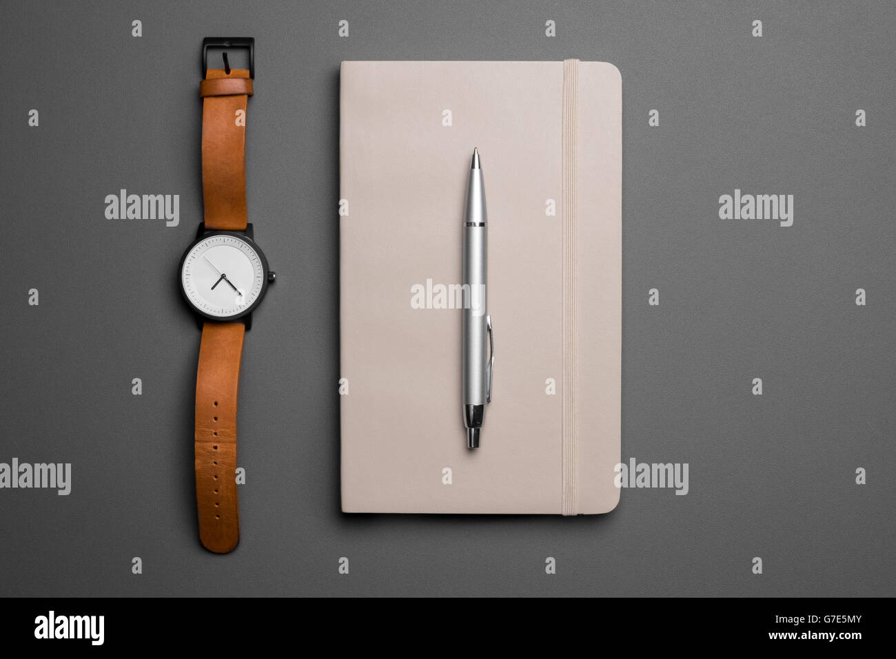 top view of watch and notebook with pen on grey background Stock Photo ...