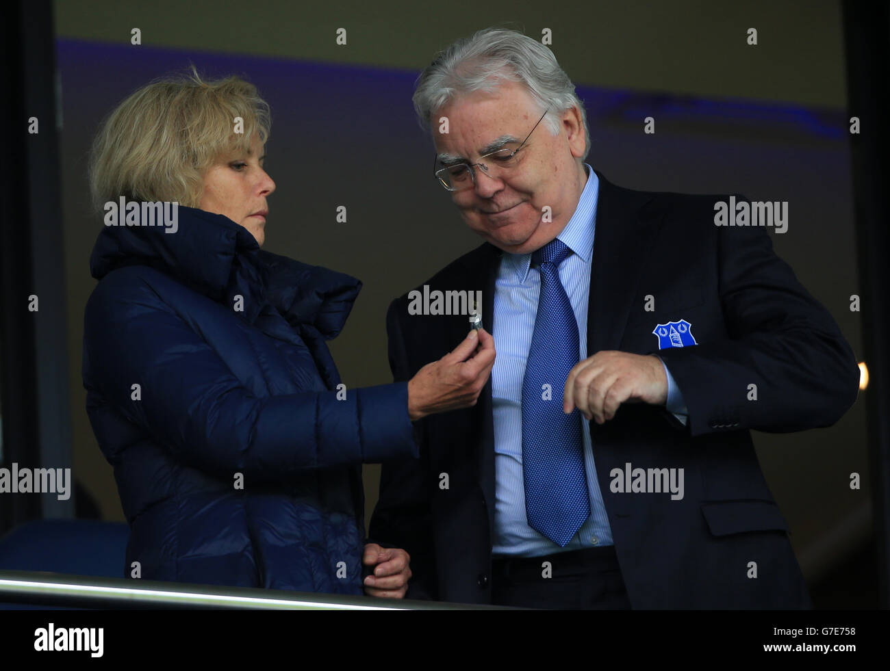 Everton Chairman Bill Kenwright with his partner Jenny Seagrove recieves a toffee sweet before the Barclays Premier League match at The Hawthorns, West Bromwich. Stock Photo