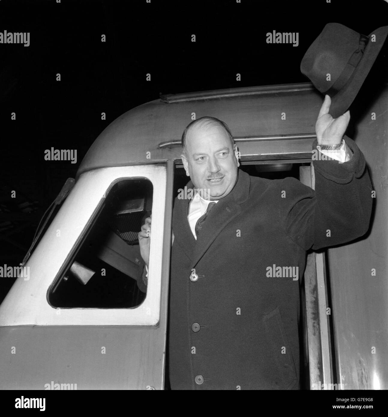 Dr Richard Beeching leaves London's Paddington Station. Dr Beeching is traveling alongside the driver of the train. Stock Photo