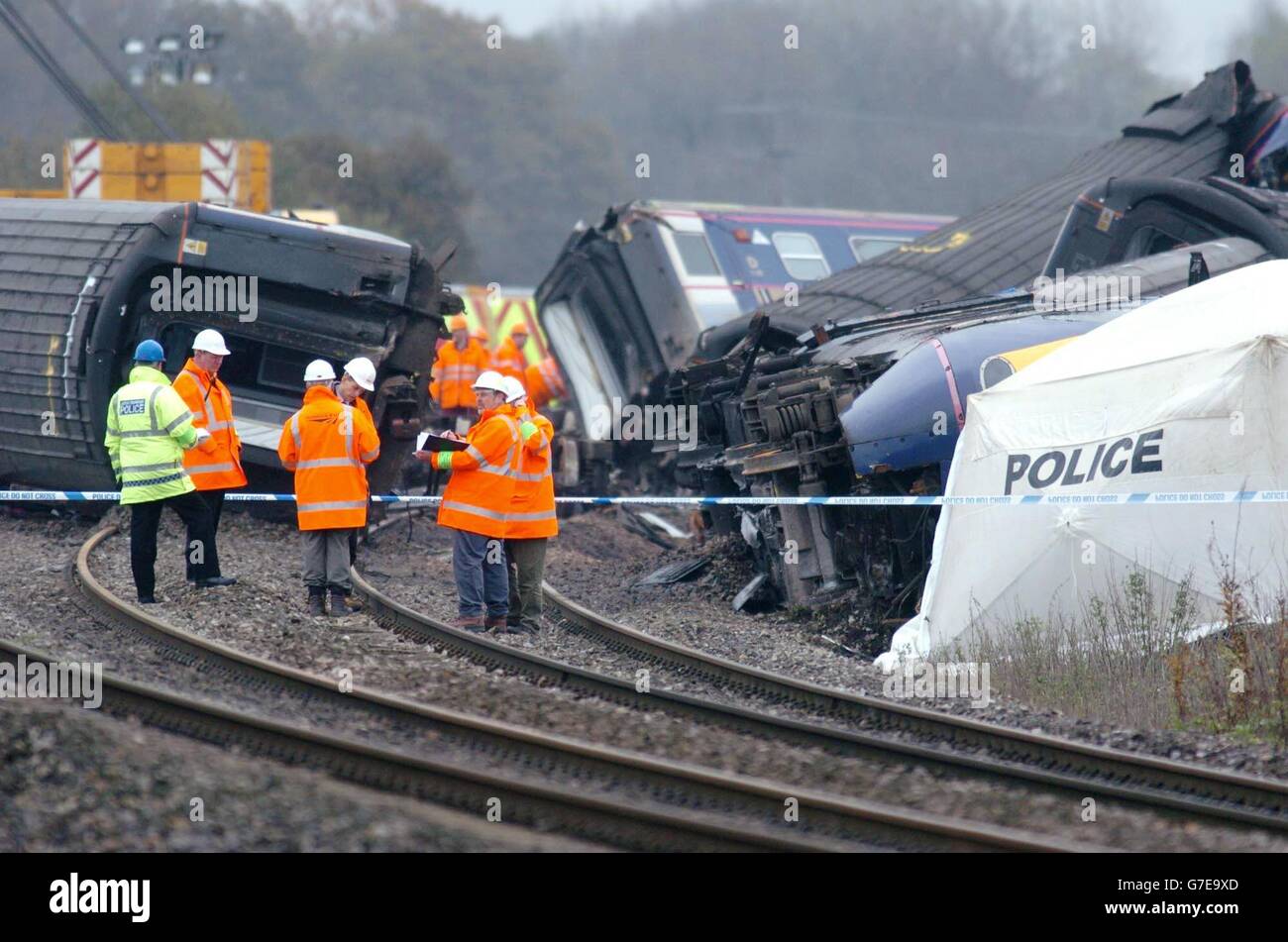 Police inspect the wreckage, of the train which hit a saloon car Saturday on a remote level crossing near Ufton Nervet in Berkshire. Six people died in the impact and a seventh died in hospital Sunday. Police investigating the incident are focusing on why a motorist parked his car in the path of the train. All the bodies have now been removed from the site and a crane is being constructed to begin clearing the wreckage. Stock Photo