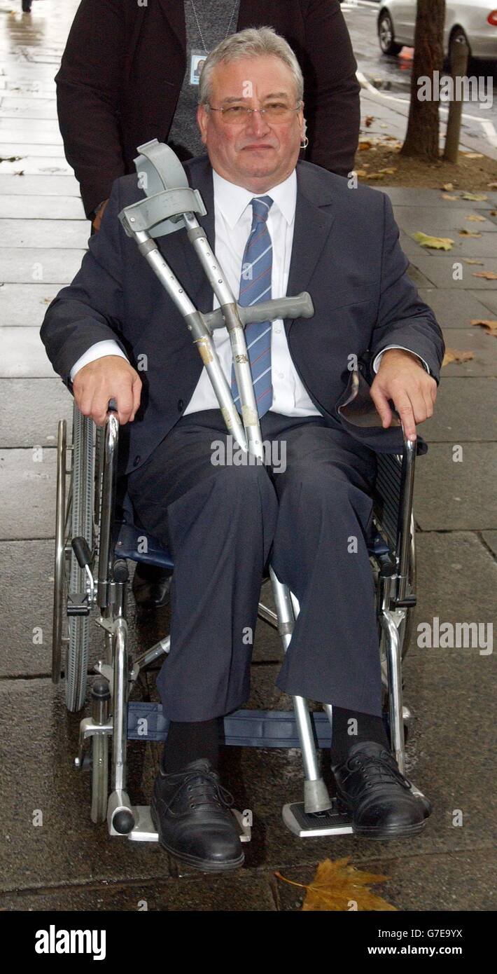 Cerebral palsy sufferer Bob Ross, 54 arrives at the Court of Appeal, London, where budget airline Ryanair are challenging a ruling that it unlawfully discriminated against him by charging to use a wheelchair at an airport. Mr Ross, 54, who has cerebral palsy and arthritis, was charged 18 at Stansted Airport to take him from the check-in desk to the plane while travelling from London to France in 2002. Campaigners for the disabled claimed that the judgment at London County Court in January that Ryanair had acted unlawfully was a landmark discrimination case. Stock Photo