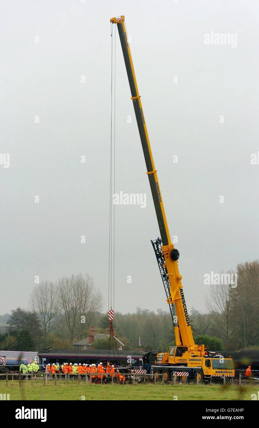 A crane in position to lift away a carriage of the mangled train wreckage which derailed at Ufton Nervet, Berkshire. Seven people died when a high speed train ploughed into a car after a motorist, apparently intent on committing suicide, stopped on a remote level crossing near the Berkshire village. Stock Photo