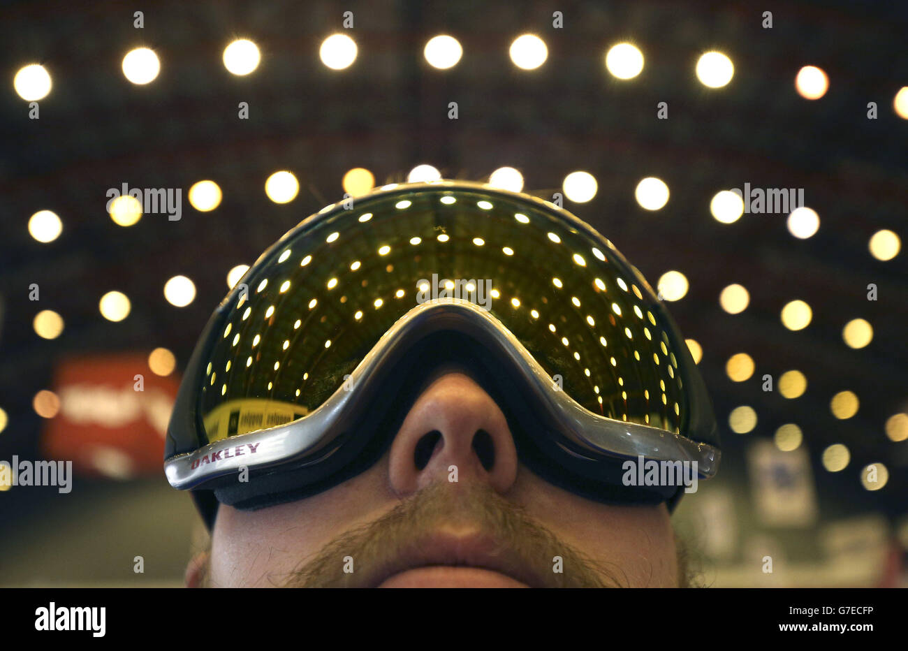 Simon Pitman tries on some goggles on the Ellis Brigham stand at the Ski and Snowboard show at