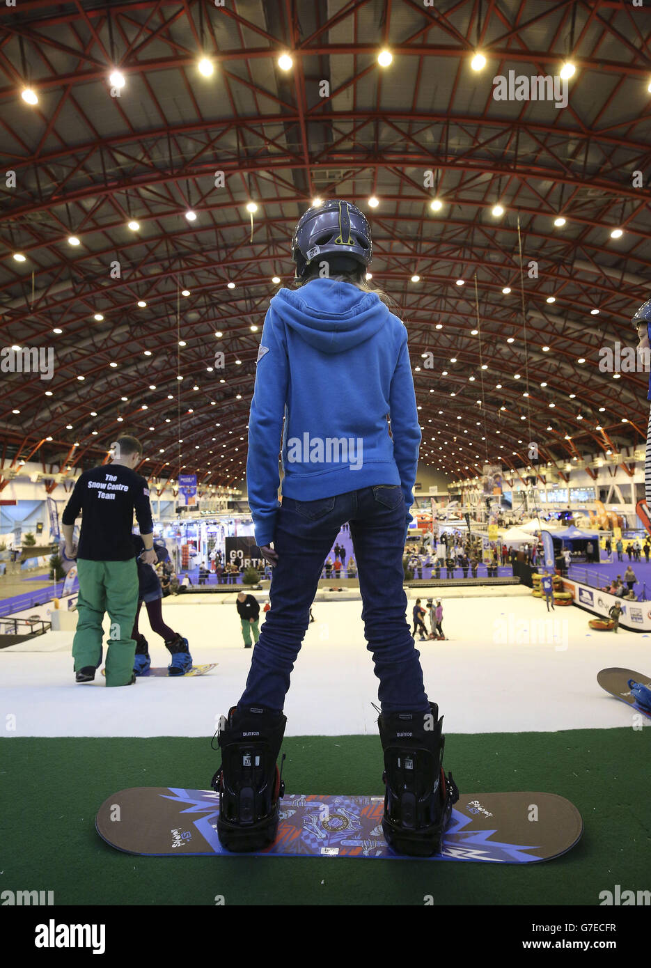Children having a snowboard lesson on the dry ski slope at the Ski and