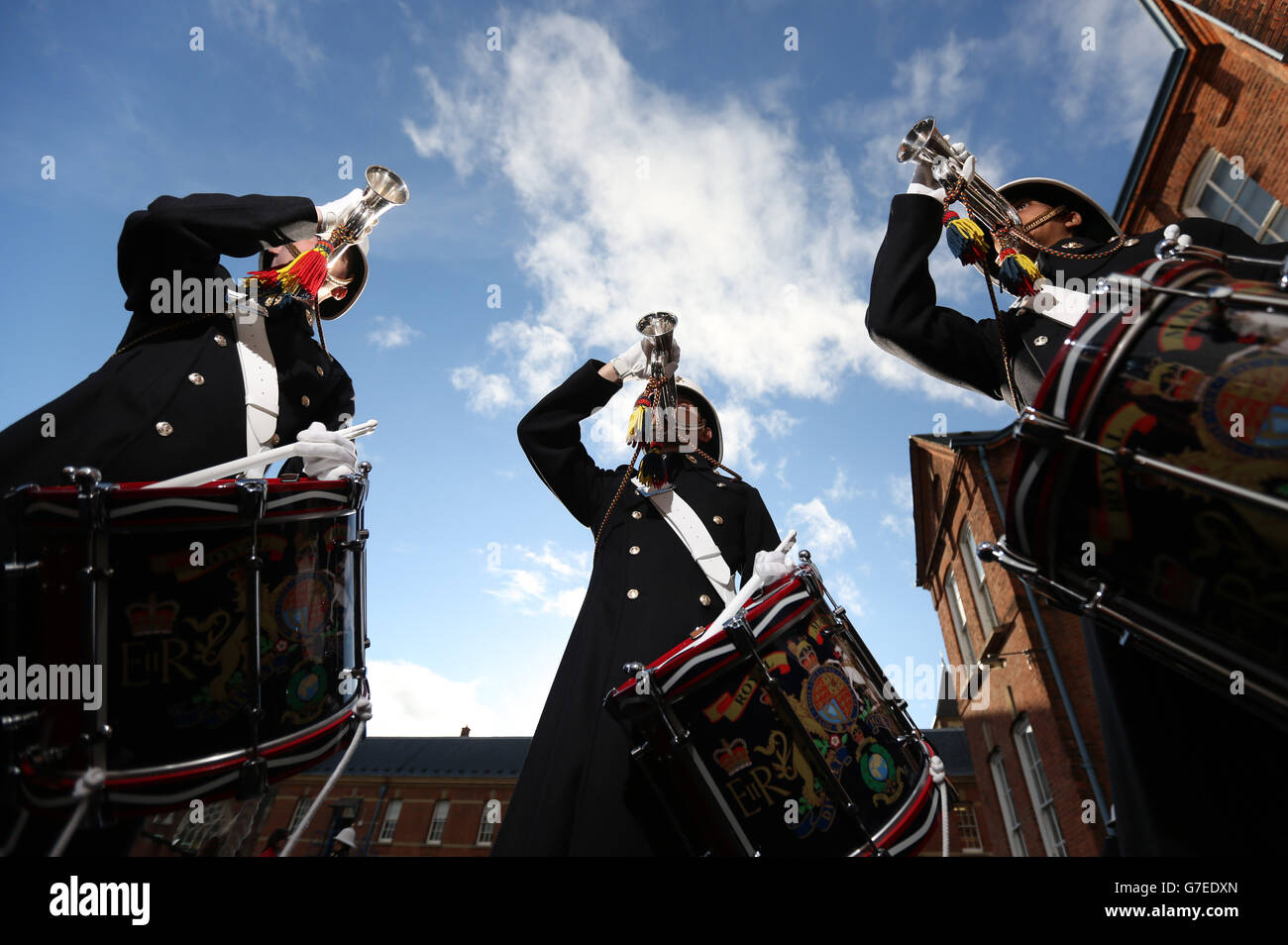 (l-r) Royal Marine Band Service Buglers Perry Lawrence, Chris Mace and Bugler Mark Metelko wear the new parade uniform in Portsmouth, Hampshire. The service has gone back to the future by unveiling its new look - a uniform the musicians last wore 50 years ago. Stock Photo