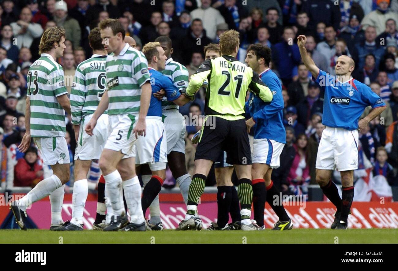 Rangers Alex Rae (R) geatures after Celtic's Alan Thompson was sent off during the Bank of Scotland Scottish Premier League match at Ibrox Stadium, Saturday November 20, 2004.. Stock Photo