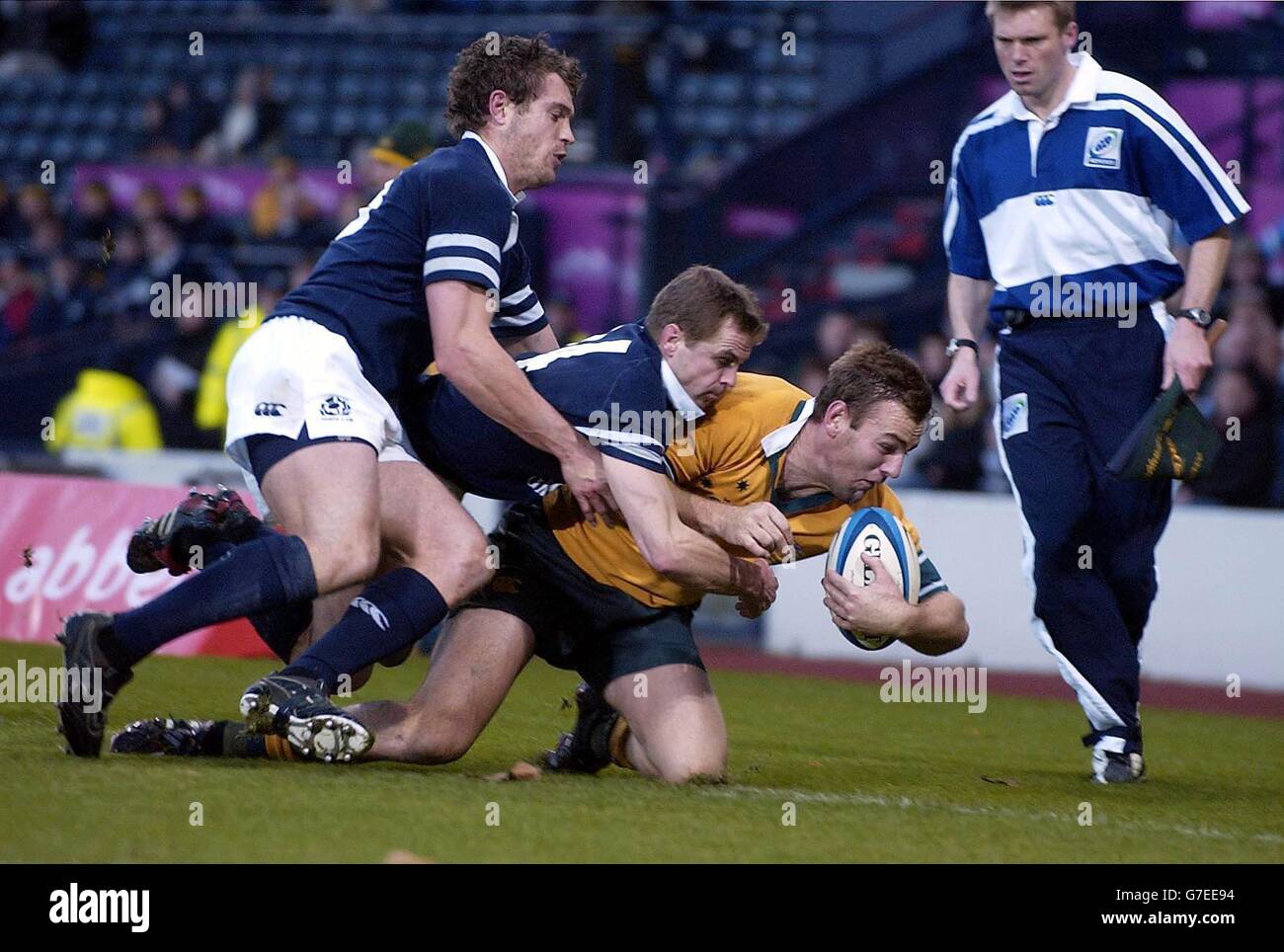 Scotland's Chris Paterson and Ben Hinshelwood tackle Australian Full Back Chris Latham during the International Match at Murrayfield. Stock Photo