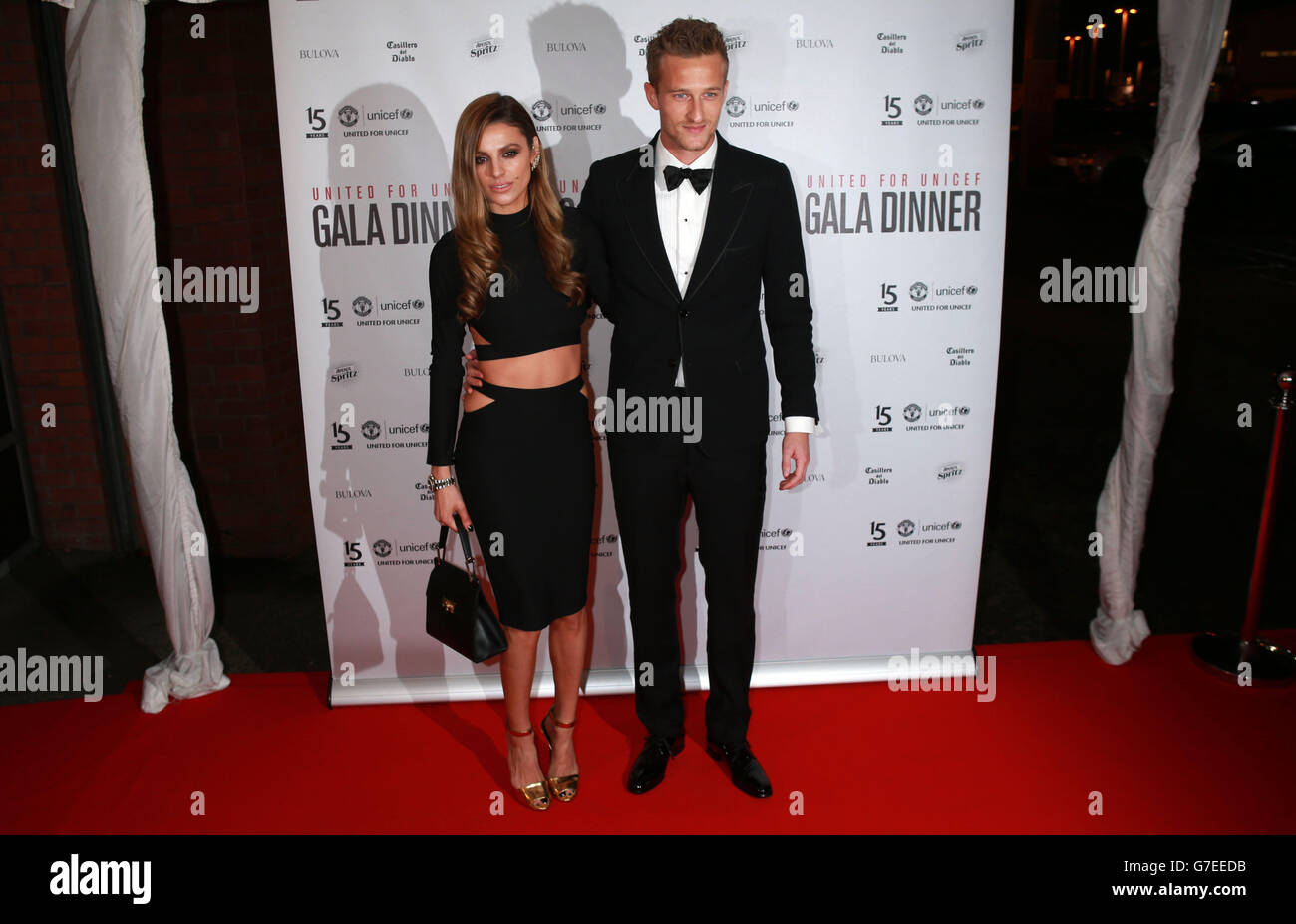 Anders Lindegaard and his wife Misse Lindegaard arrive at the United for UNICEF Gala Dinner attended by the Manchester United first-team and VIP guests at Old Trafford, Manchester. Stock Photo