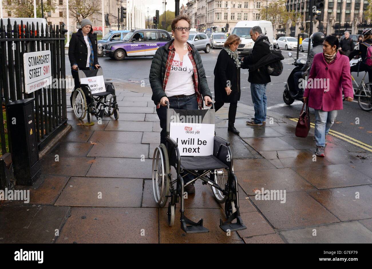 Disability rights campaigners lead a rally against the assisted suicide ...
