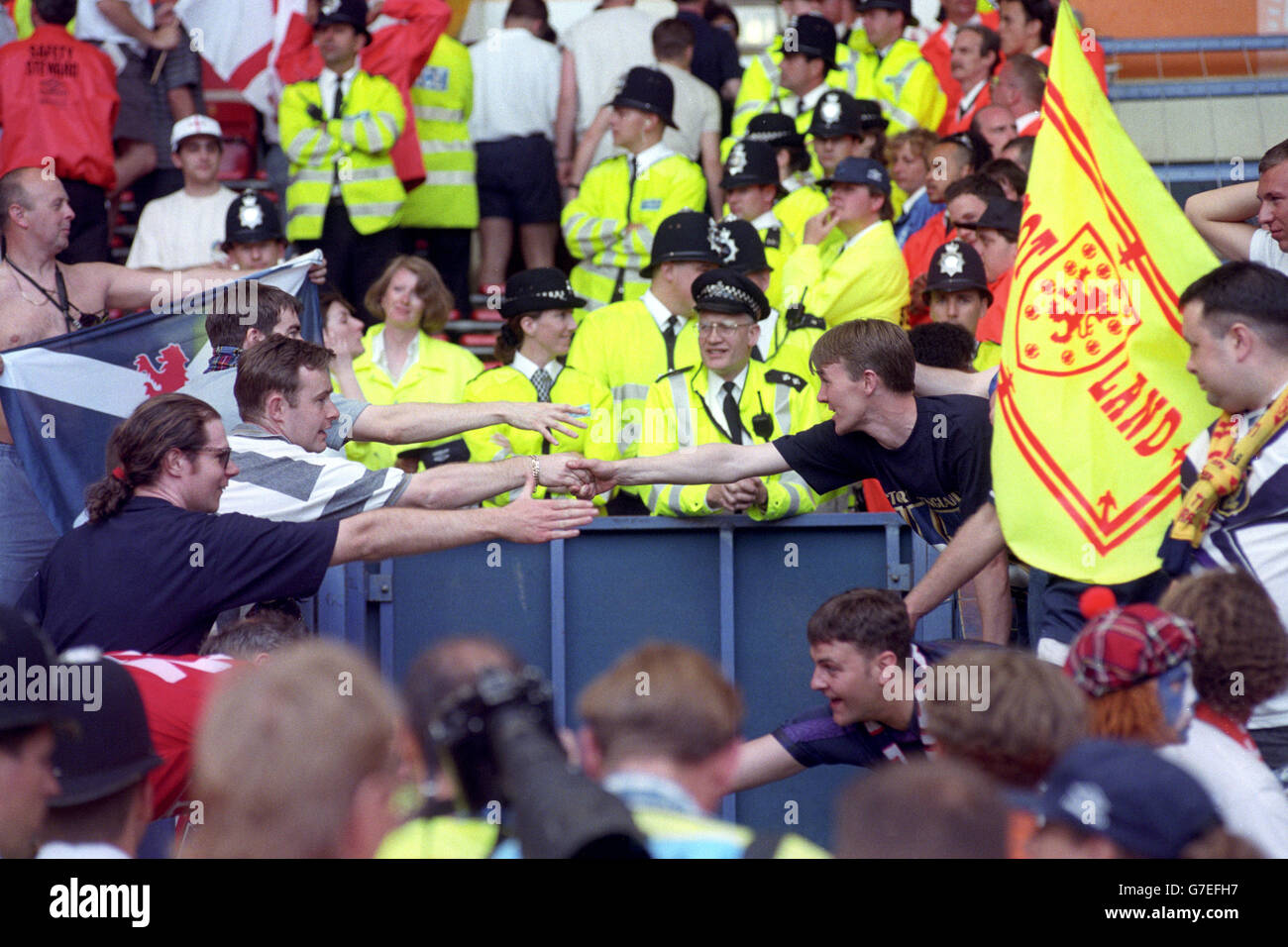 Scotland and England fans shake hands at the end of the Euro '96 clash at Wembley. England won the game 2-0. Stock Photo