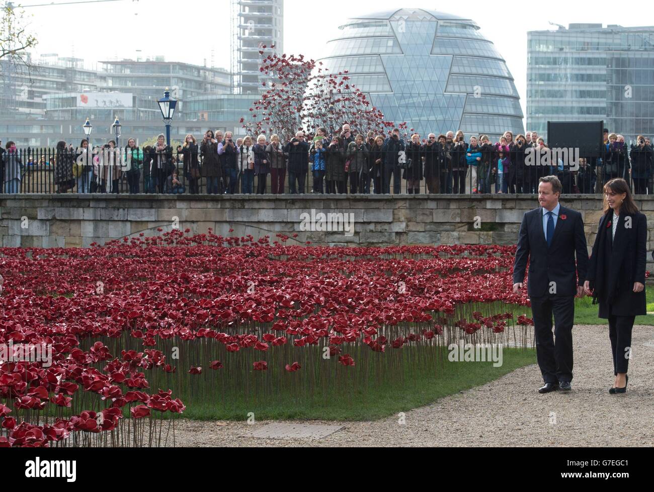 Prime Minister David Cameron and his wife Samantha arrive at the Tower of London to each lay a poppy at the art installation 'Blood Swept Lands and Seas of Red' by artist Paul Cummins which marks the centenary of the First World War. Stock Photo